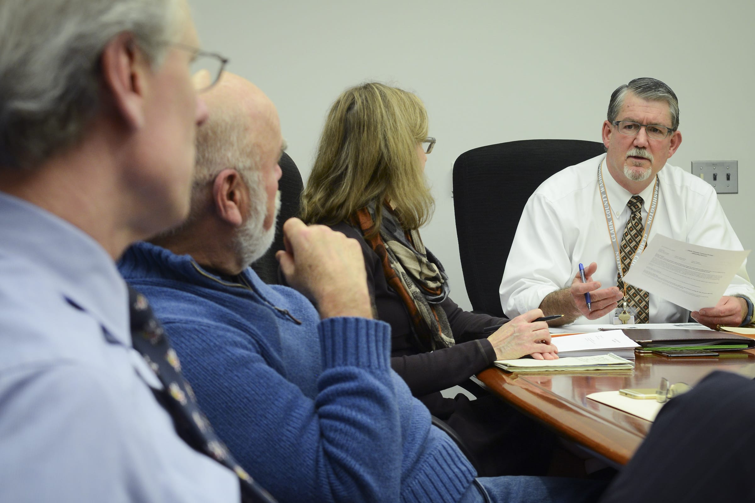 Clark County Administrator Mark McCauley, right, attends a finance committee meeting Tuesday afternoon with county employees, from left, Mark Gassaway, Bob Stevens and Laura Pedersen. Earlier Tuesday, McCauley accepted an offer from county commissioners to be acting county manager.