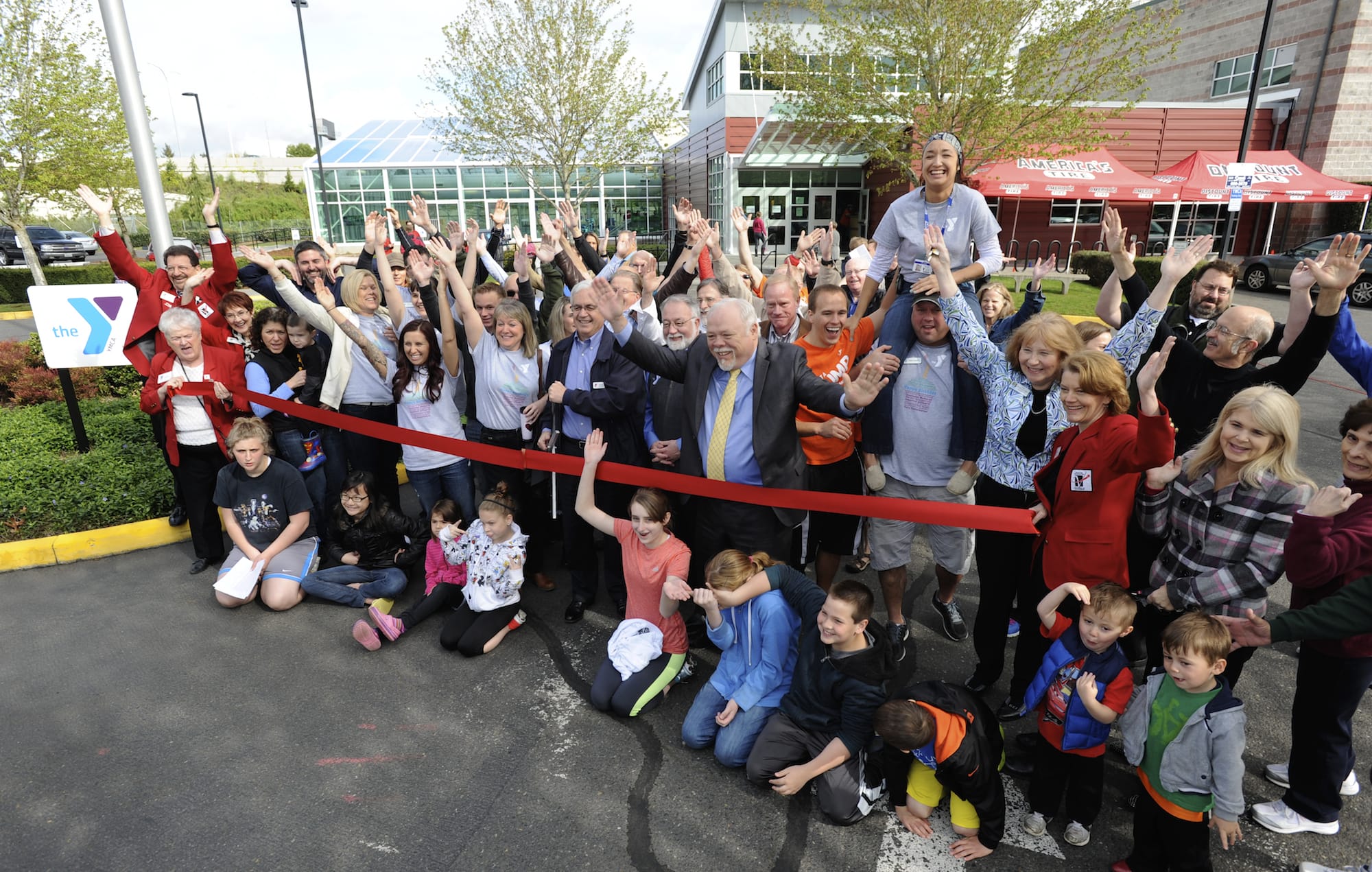 Supporters, staff and dignitaries gather Saturday to celebrate the ribbon cutting and grand reopening of the Clark County Family YMCA.