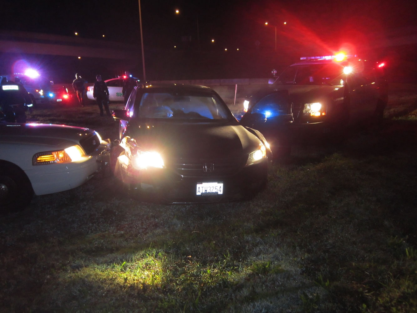 A reportedly stolen Honda is hemmed in by patrol cars after a pursuit ended near the Interstate 5 bridge.