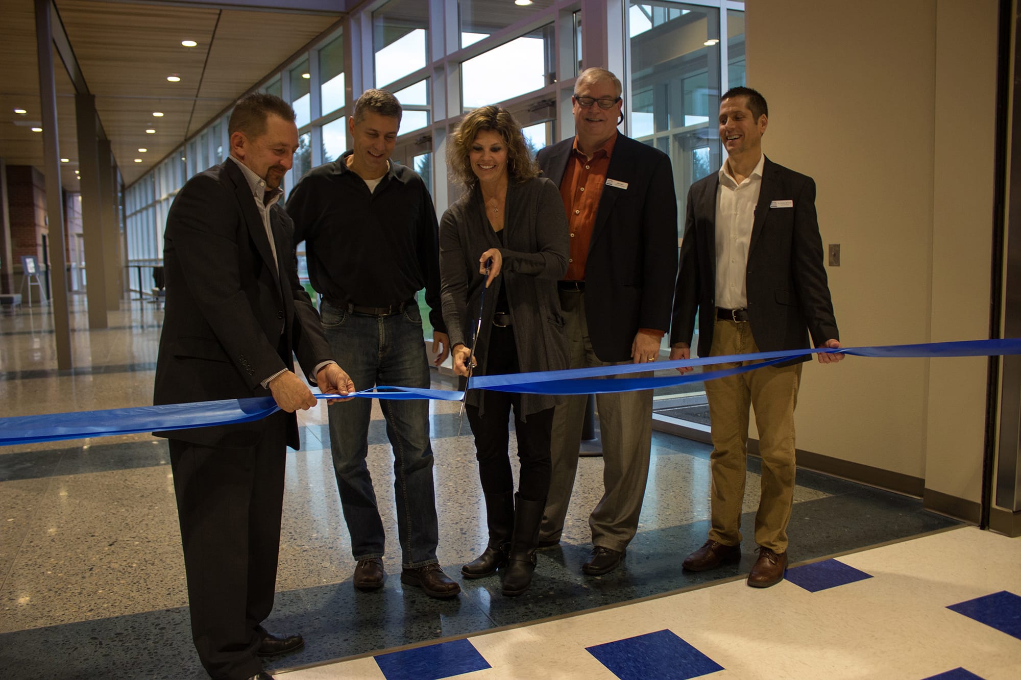 Ridgefield: Ridgefield School District board members Scott Gullickson, from left, Steve Radosevich, Becky Greenwald and Jeff Vigue cut a ribbon with Superintendent Nathan McCann at a Dec.