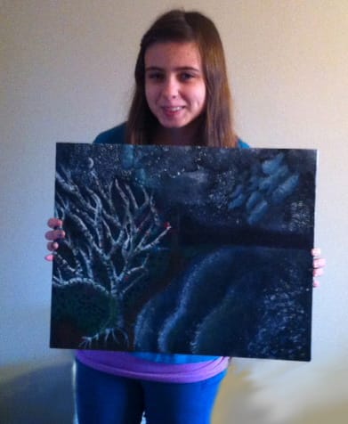 Pleasant Valley: Pleasant Valley Middle School seventh-grader Veronica Burch holds her acrylic painting, &quot;Growing with Perseverance.&quot;