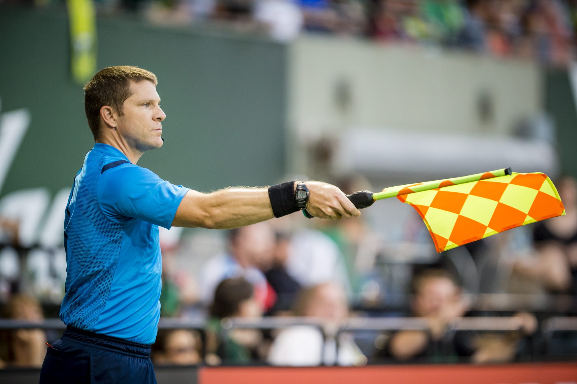 MLS Assistant Referee Jeremy Hanson of Vancouver works the sideline at the Portland Timbers' match against the Chicago Fire Friday Aug. 7th at Providence Park.