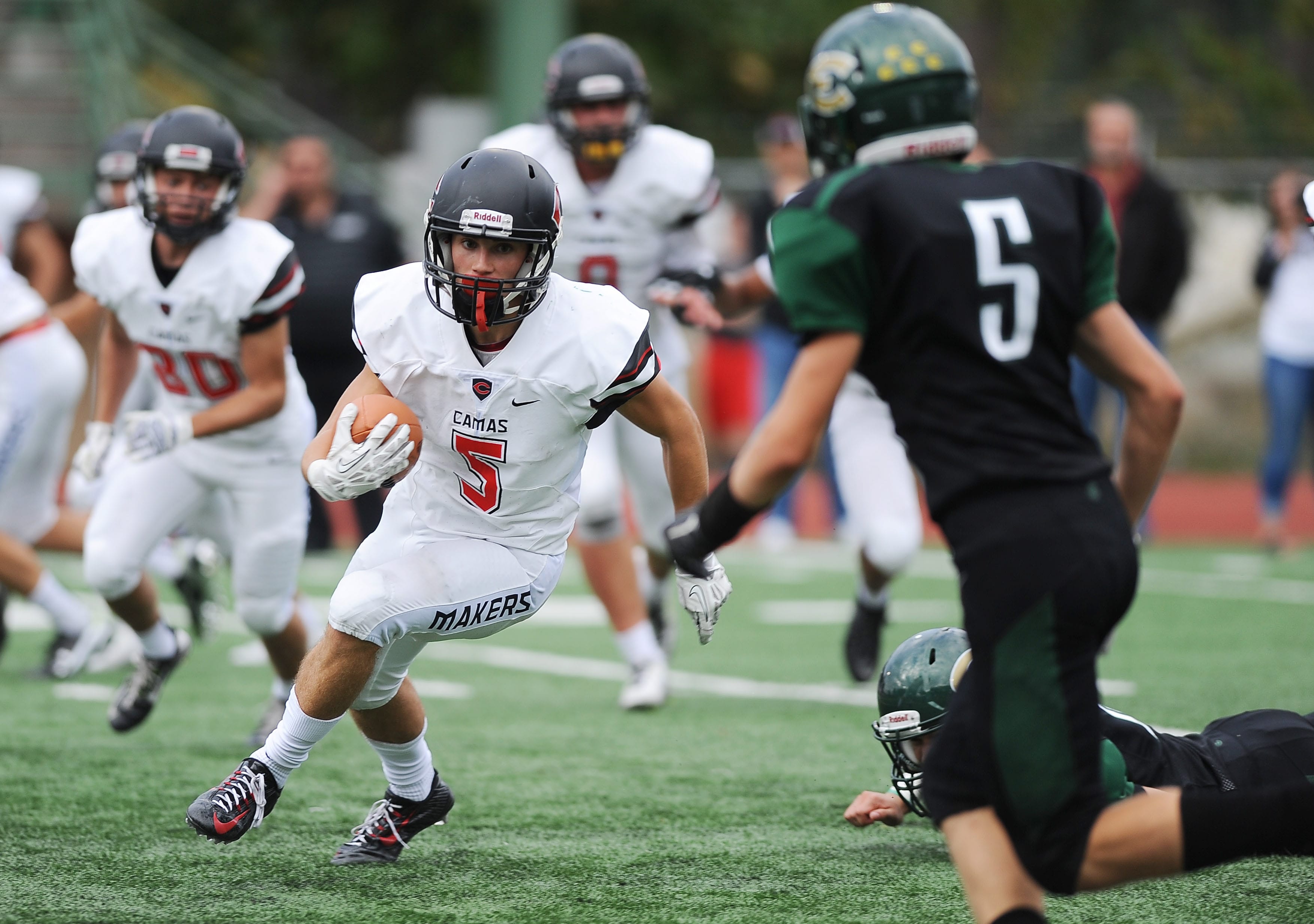 Camas player Jared Bentley runs with the ball during a game against Evergreen at McKenzie Stadium on Friday.