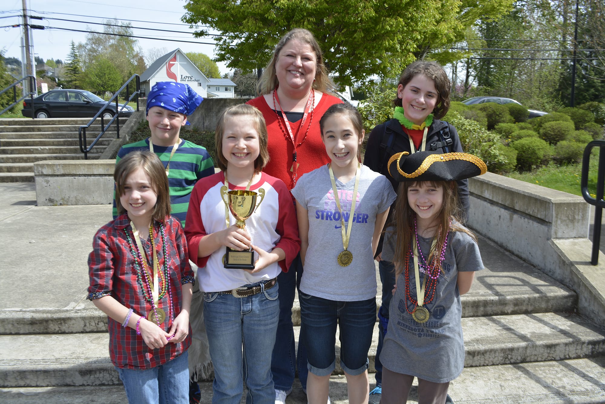 Washougal: The Swashbucklers, from Cape Horn-Skye Elementary, show off the trophy the students won during the Washougal School District's first Battle of the Books. Back row, from left: Gavin Keyser, Cape Horn-Skye Elementary Library Assistant Tammy Asbjornsen and Brynn Haralson.