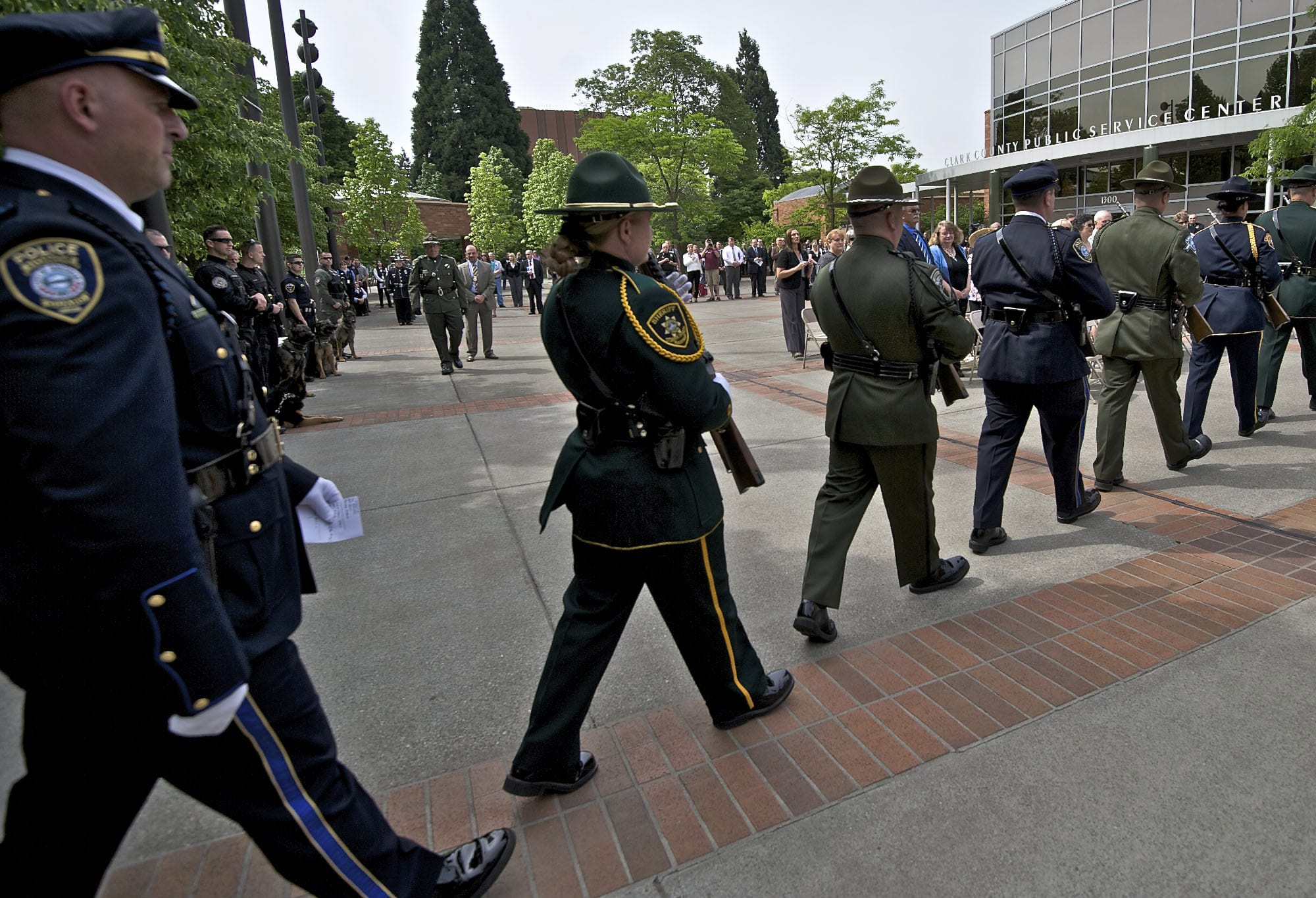 A multi-agency Honor Guard follows the posting of the colors during Thursday's Law Enforcement Memorial Ceremony in the courtyard of the Public Service Center in Vancouver.