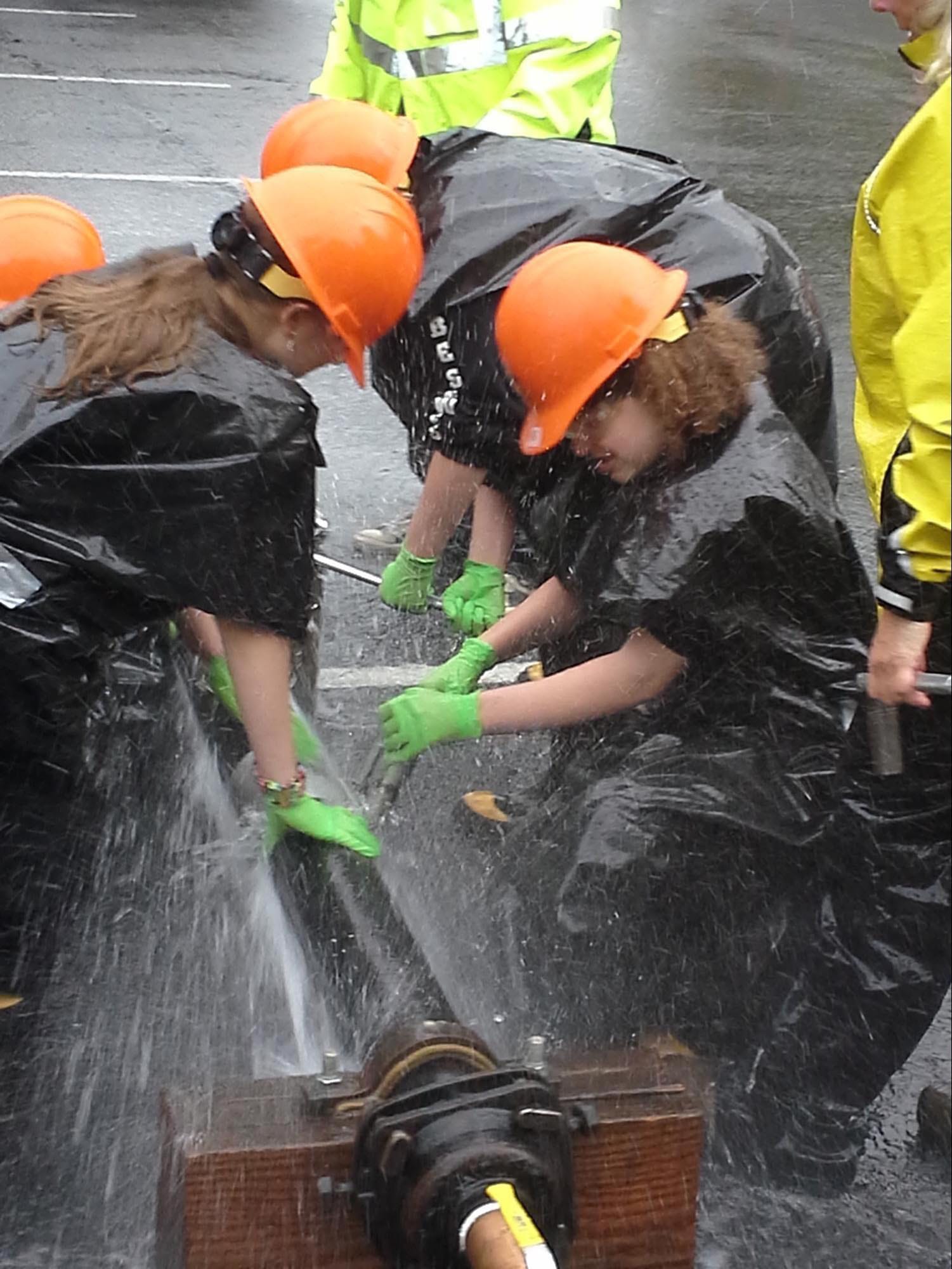 Battle Ground: Sixth-grade girls from Maple Grove School got some practice repairing a broken water main during a May 14 visit to the Women In Trades Career Fair at the Oregon Convention Center in Portland.