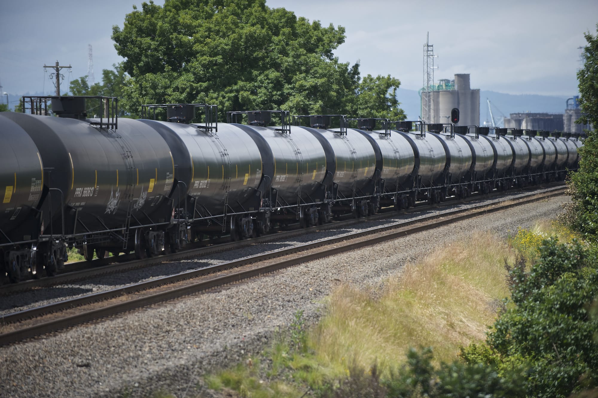 An oil train passes the Vancouver Land Bridge in Vancouver.