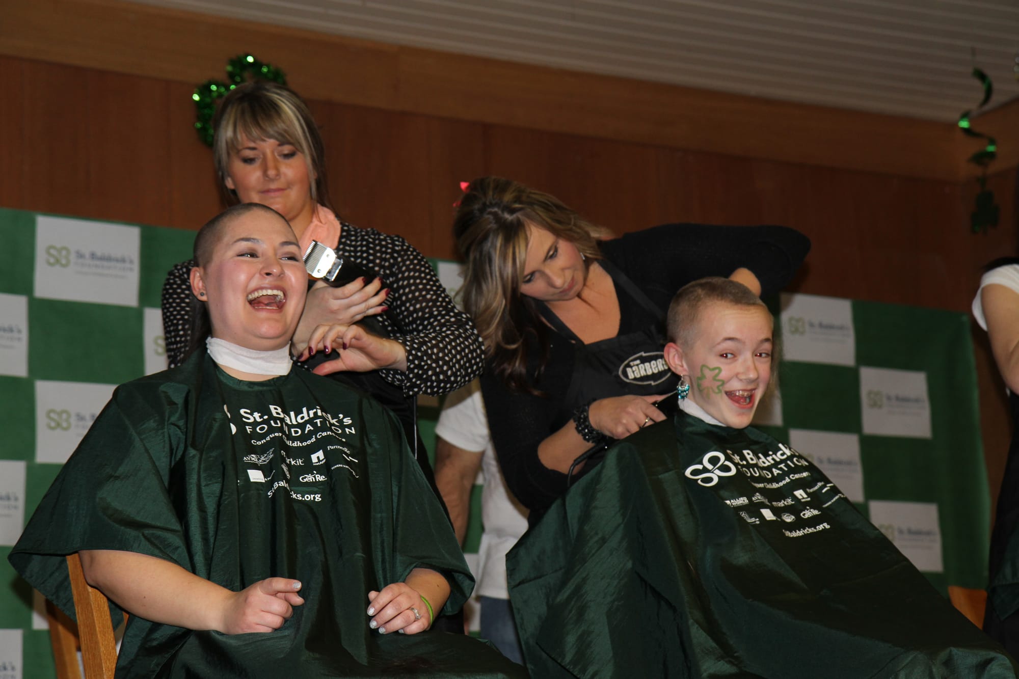 Camas: Teacher Angela Dasso, left, and sixth-grade student Jerrica Pachl lose their locks at a St. Baldrick's Foundation fundraising event on Jan.