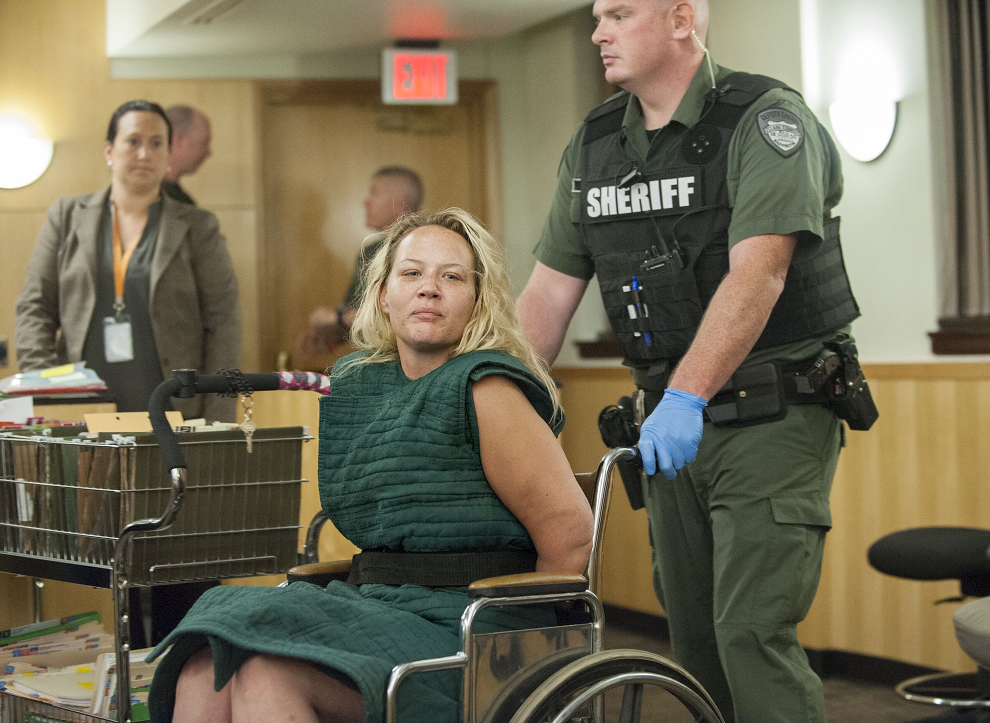 Jessica Farias, 33, of Vancouver makes a first appearance Tuesday in Clark County Superior Court. Farias is accused of driving erratically through Hazel Dell on Monday morning and then reaching for a deputy's gun, causing it to fire, while resisting arrest.