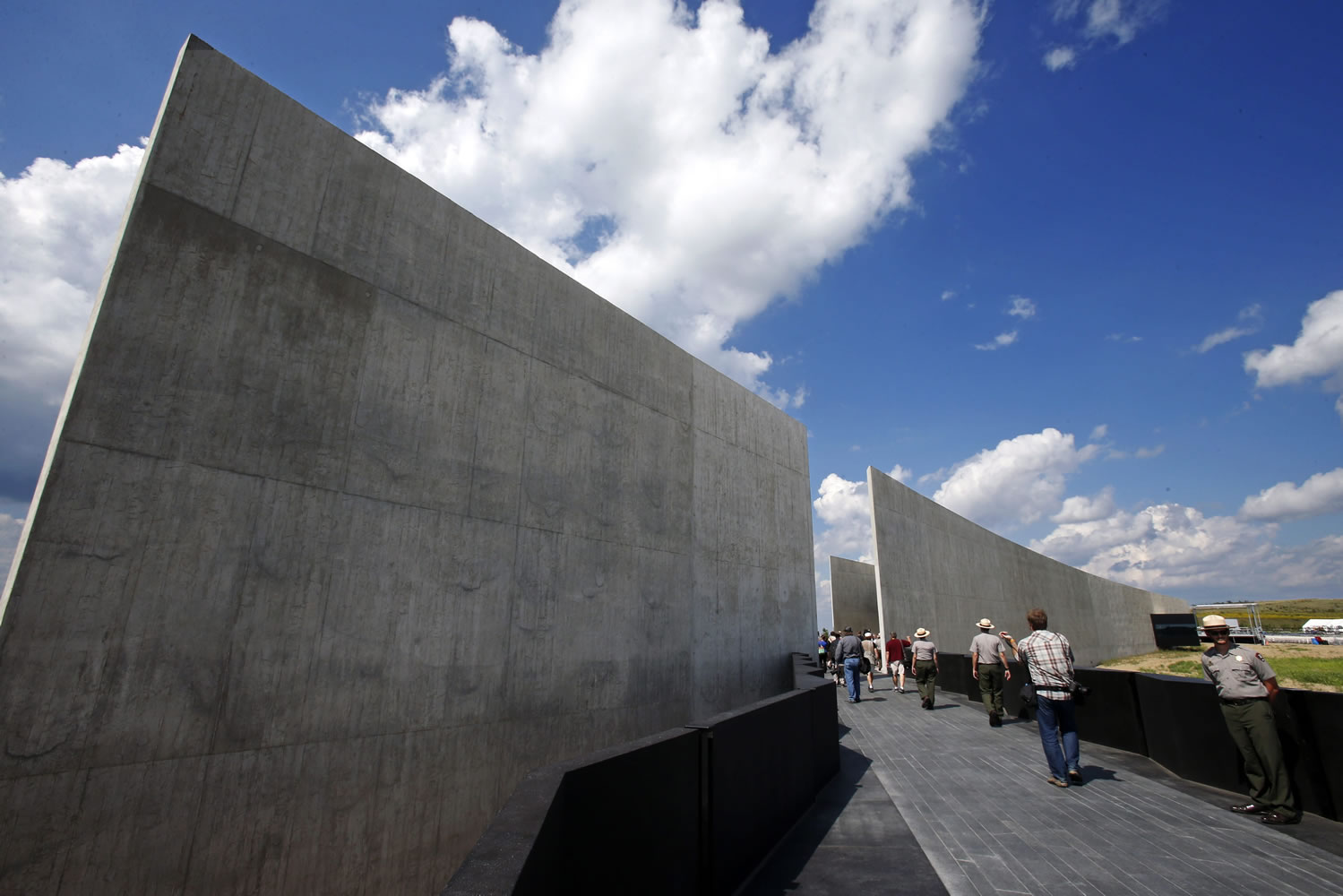 Members of the media get a preview of the the Flight 93 National Memorial visitors center complex in Shanksville, Pa., Wednesday, Sept. 9, 2015. The visitors center will be formally dedicated and open to the public on Sept. 10, 2015. (AP Photo/Gene J.