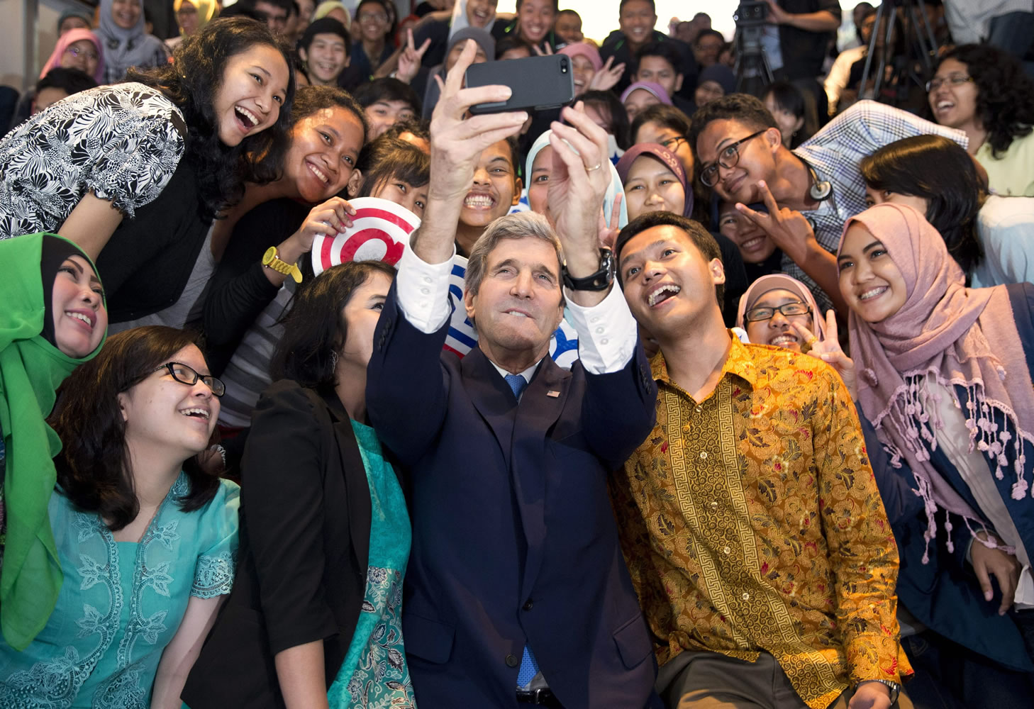 Secretary of State John Kerry takes a selfie with a group of students Sunday before delivering a speech on climate change in Jakarta, Indonesia.