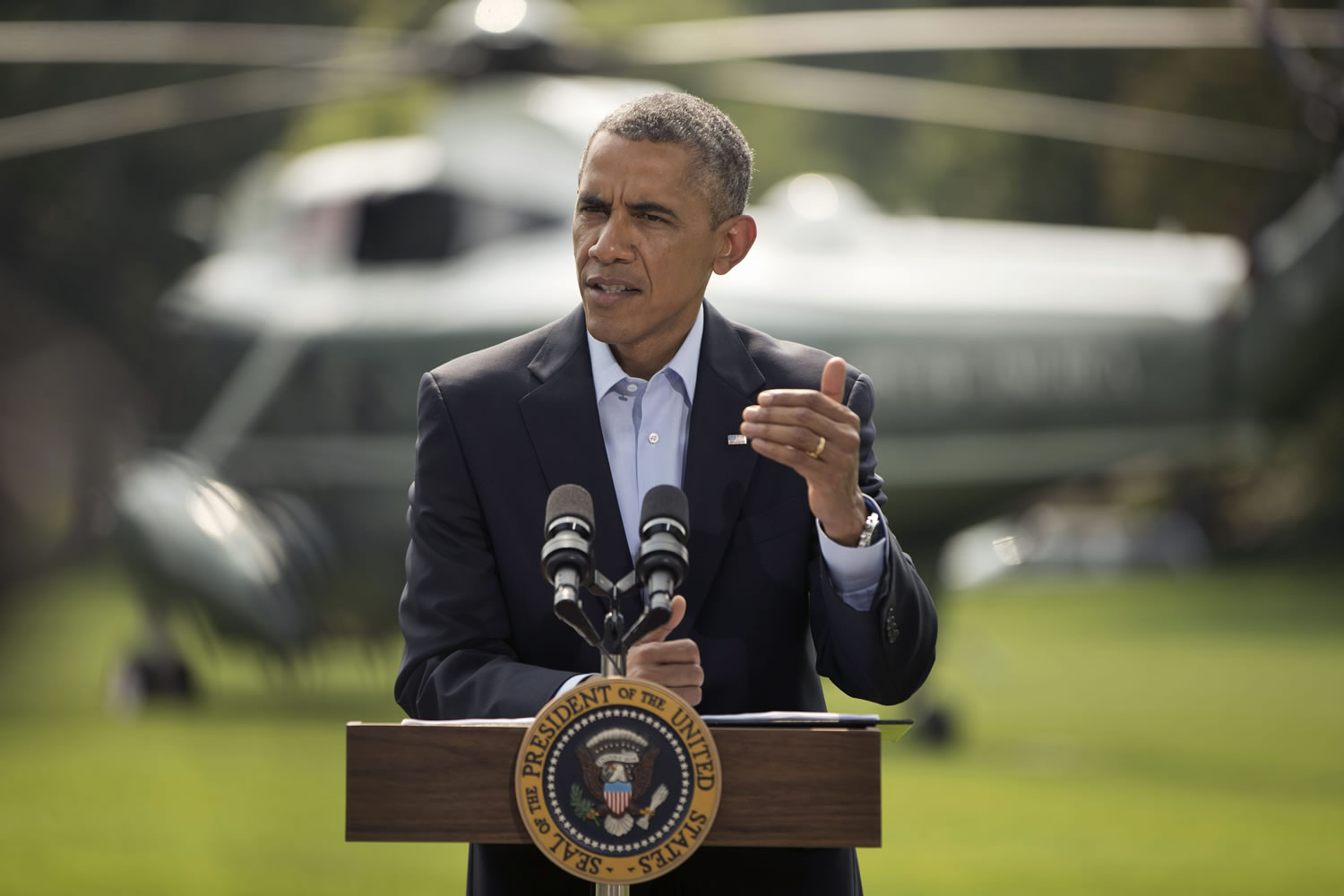 President Barack Obama speaks on the South Lawn of the White House in Washington on Saturday about ongoing situation in Iraq before his departure on Marine One for a vacation in Martha's Vineyard.