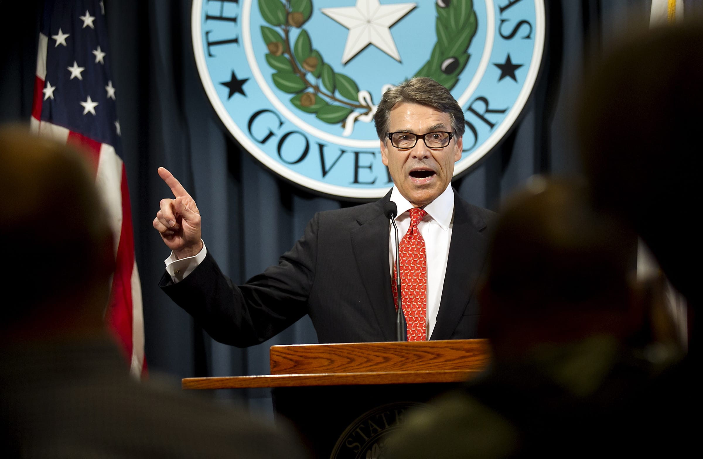 Gov. Rick Perry makes a statement in Austin, Texas, on Saturday concerning the indictment on charges of coercion of a public servant and abuse of his official capacity.