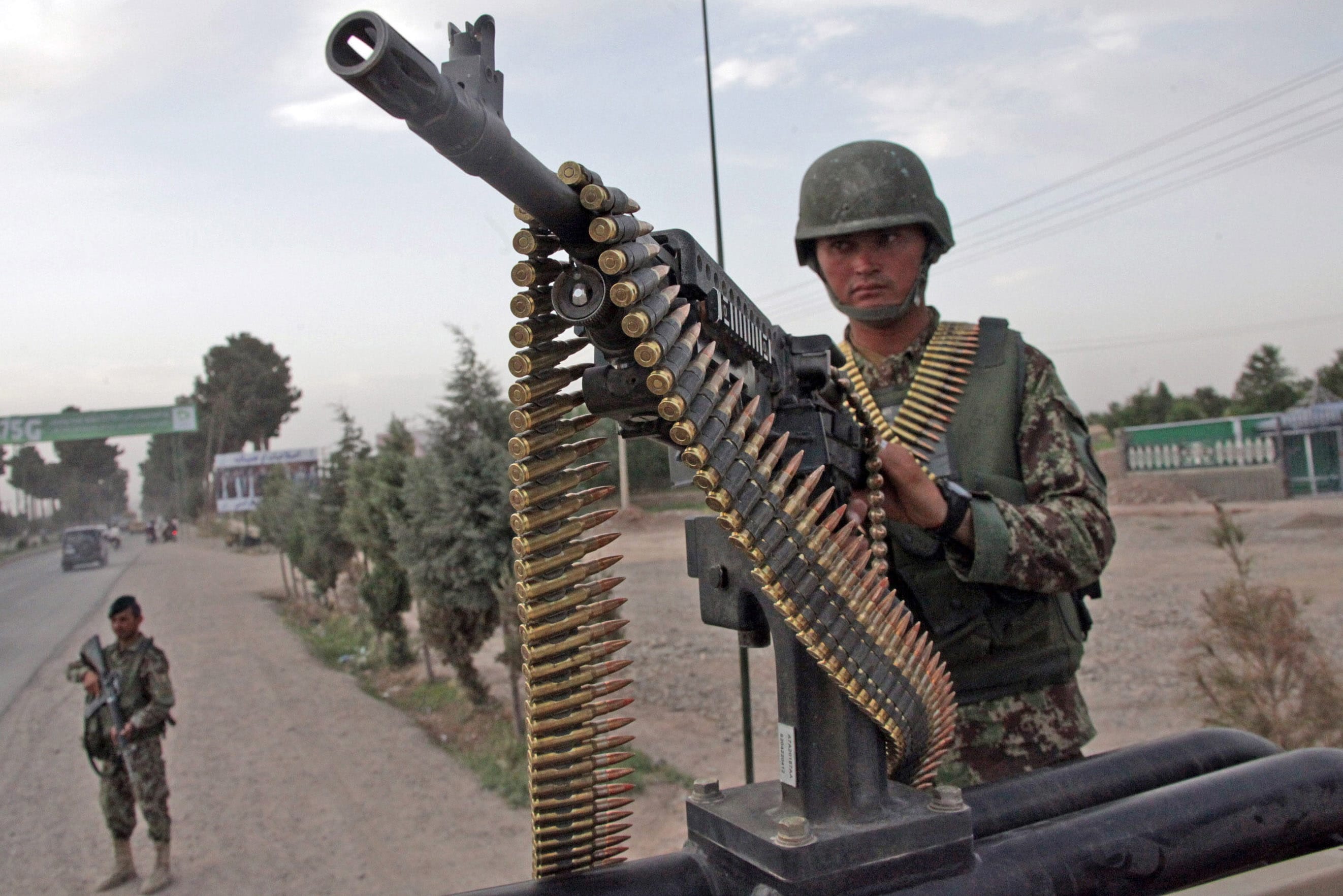Afghanistan National Army soldiers stand alert Friday in a street in Herat, west of Kabul, Afghanistan.