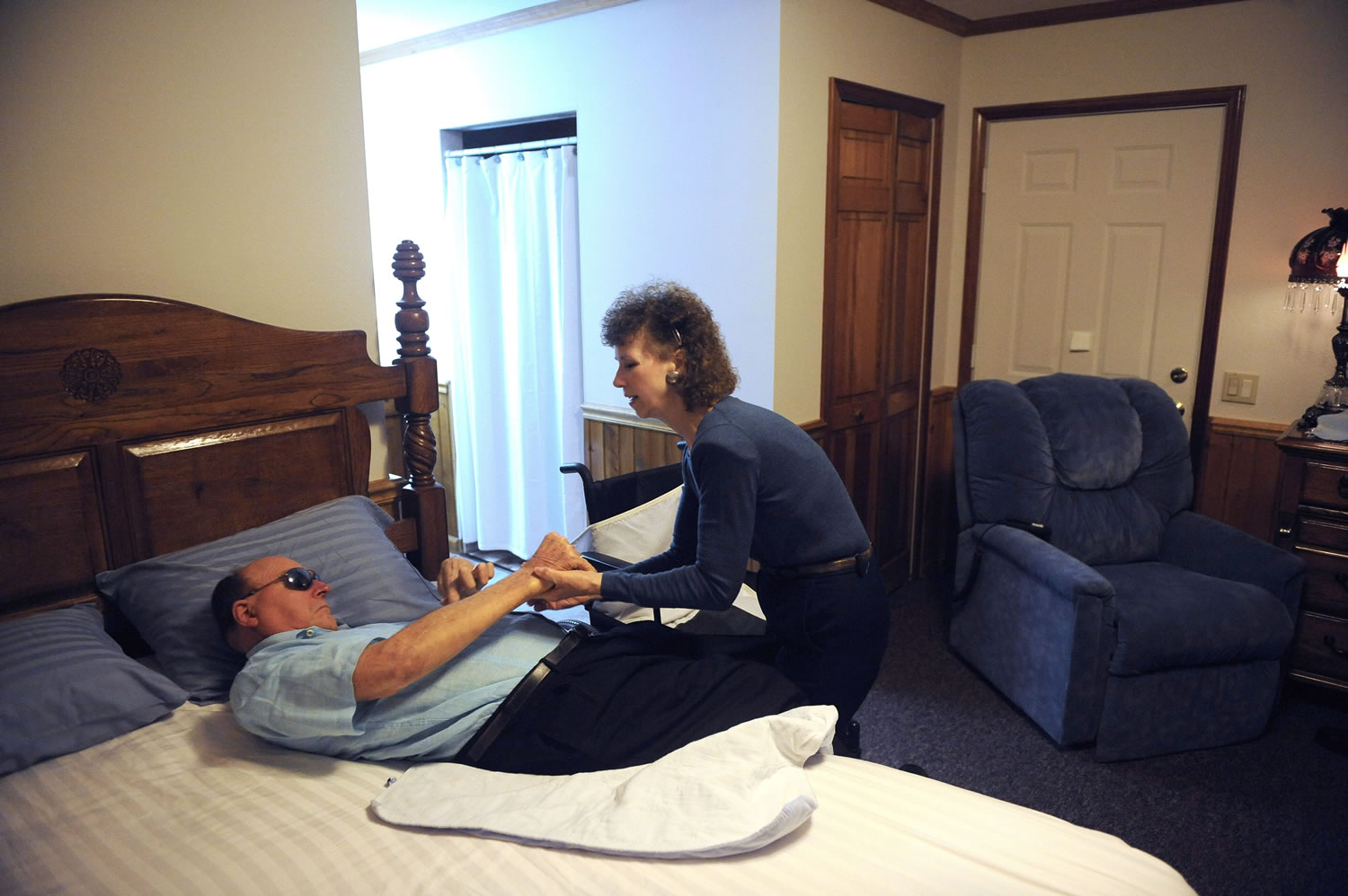 Pauline King cares for her husband, Jerry King, at their home in Anna, Ill.