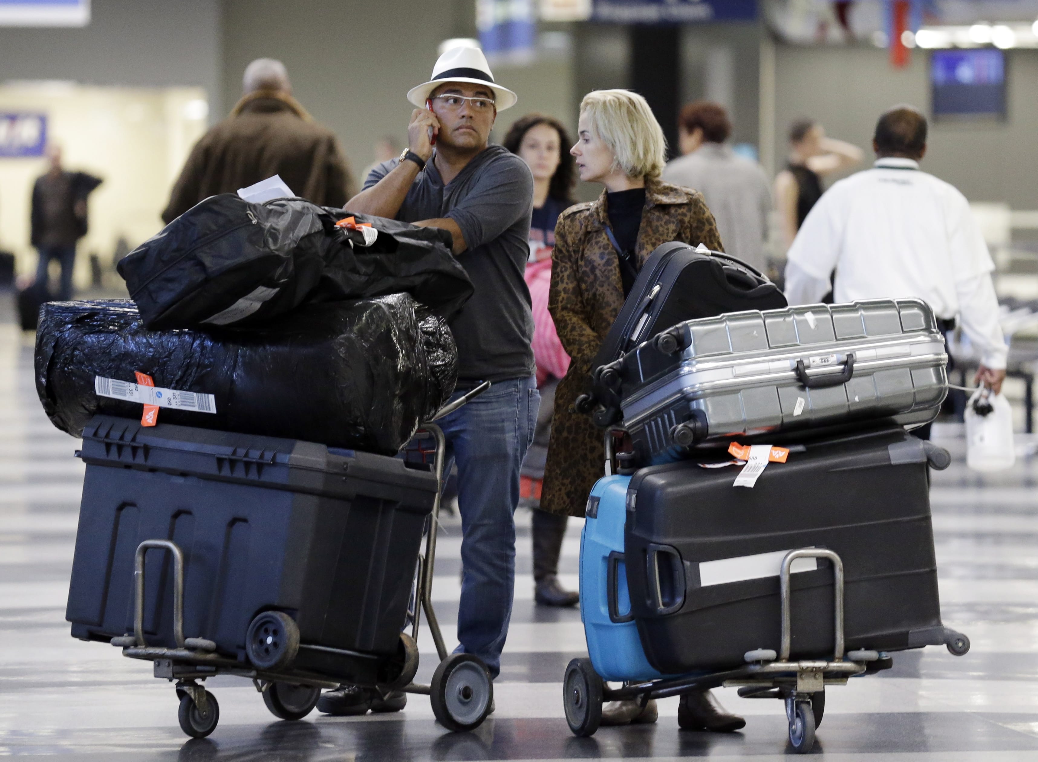 Travelers walk through the terminal 3 baggage claim at O'Hare International airport in Chicago in 2013.