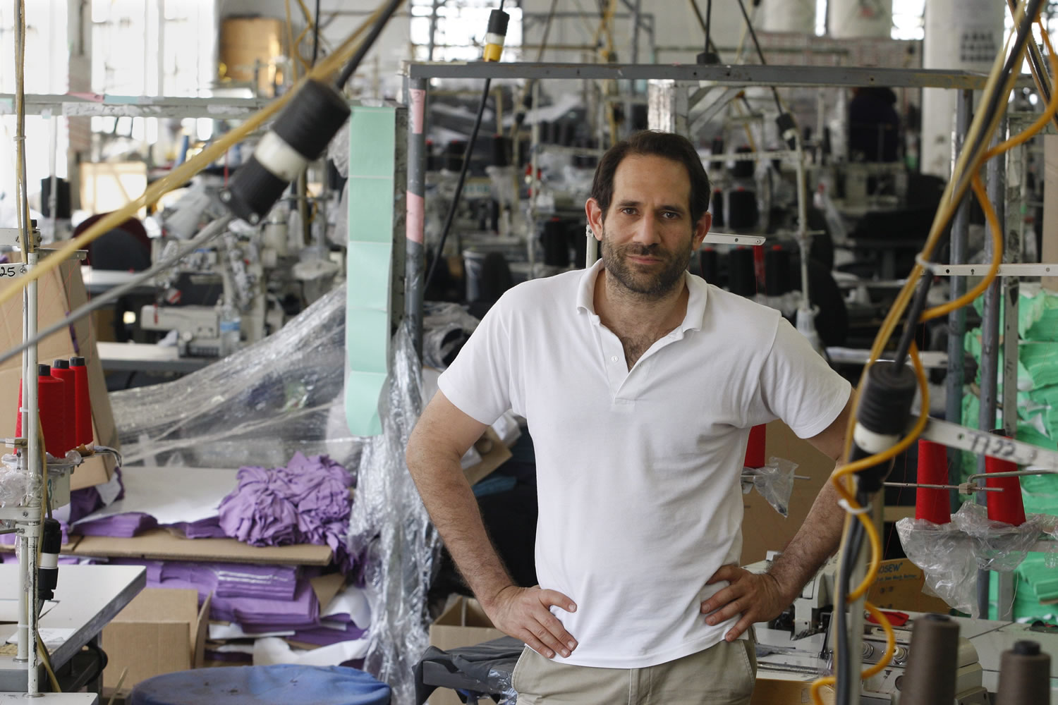 The board of American Apparel voted to oust Dov Charney as chairman and notified him of its intent to remove him as president and chief executive, the clothing chain said in a statement Wednesday night.