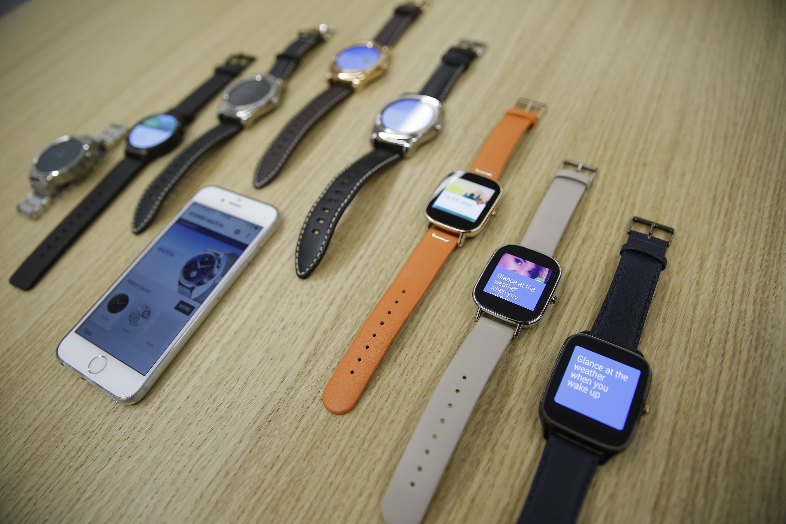 Google is introducing an application that will connect Android smartwatches with Apple's iPhone, escalating the rivals' battle to strap their technology on people's wrists.