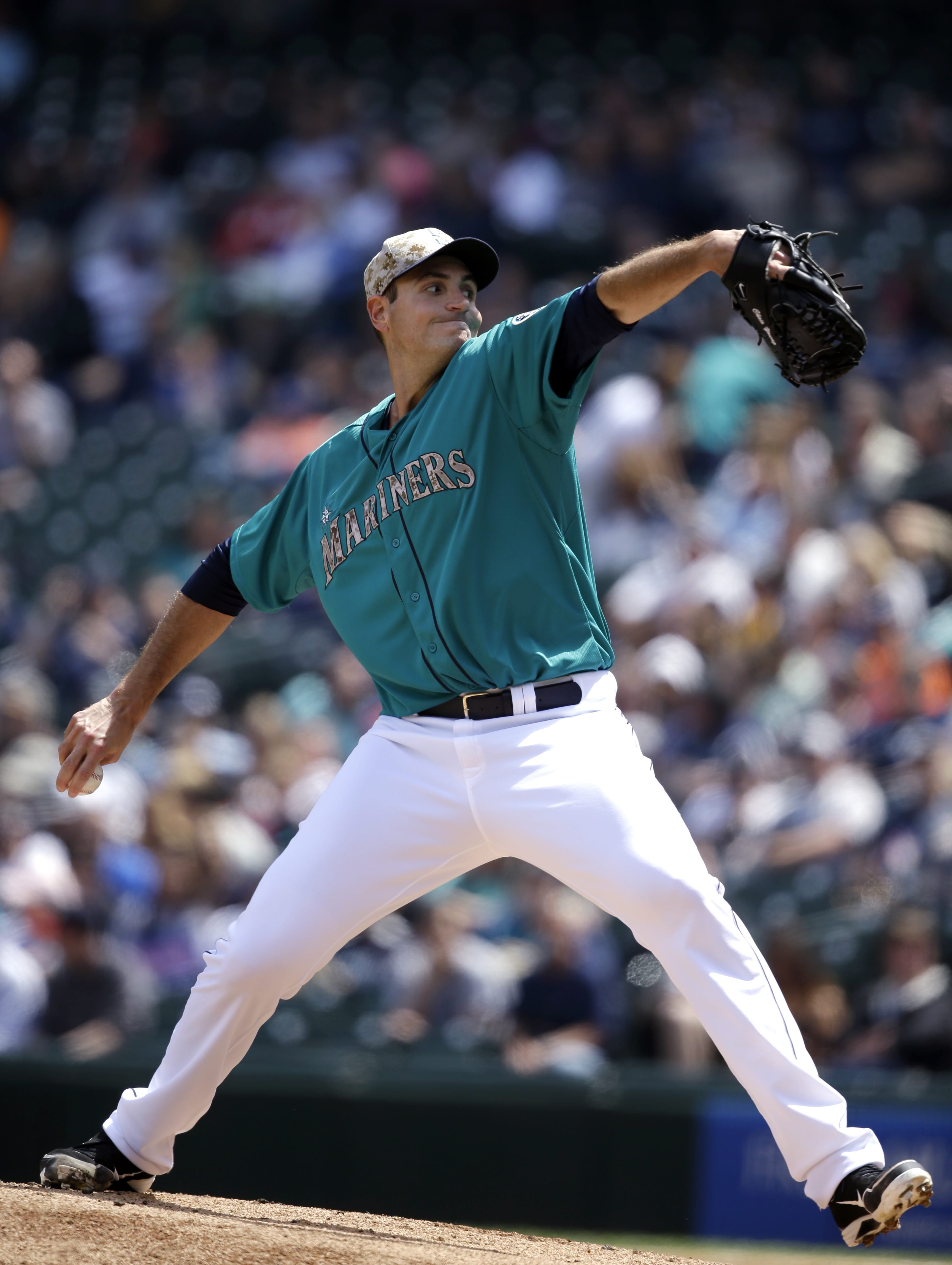 Seattle Mariners starting pitcher Chris Young throws against the Los Angeles Angels in the first inning of a baseball game Monday, May 26, 2014, in Seattle.