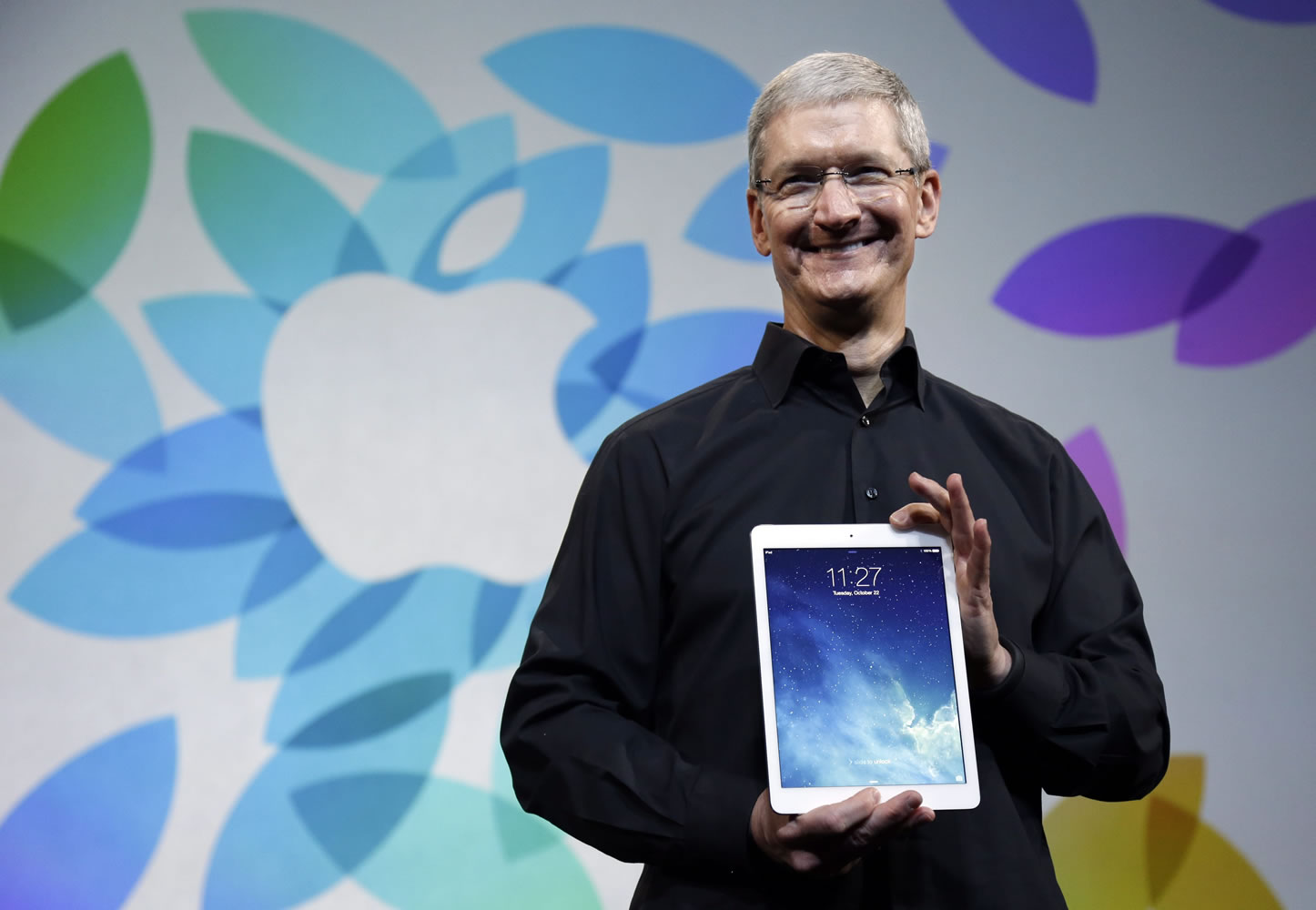 Associated Press files
Apple CEO Tim Cook introduces the new iPad Air in San Francisco in October.