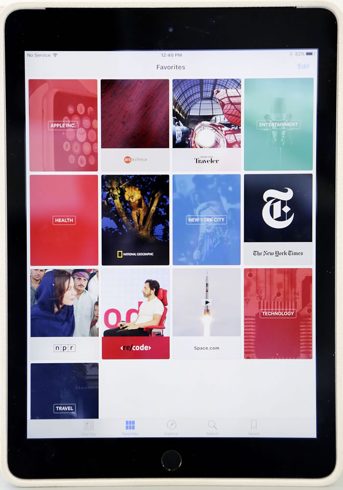 The &quot;favorites&quot; section of Apple's new News app is displayed on an iPad in New York. The tech giant will launch a news service for iPhones and iPads this month featuring partnerships with more than 50 companies so far, including CNN and National Geographic.