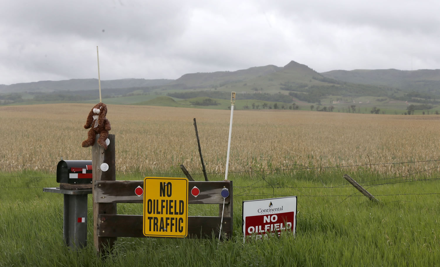 Several signs remind drivers of large trucks used by the oil industry to avoid the road to farmlands and the historical Killdeer Mountian historic battlefield Wednesday near Killdeer, N.D.