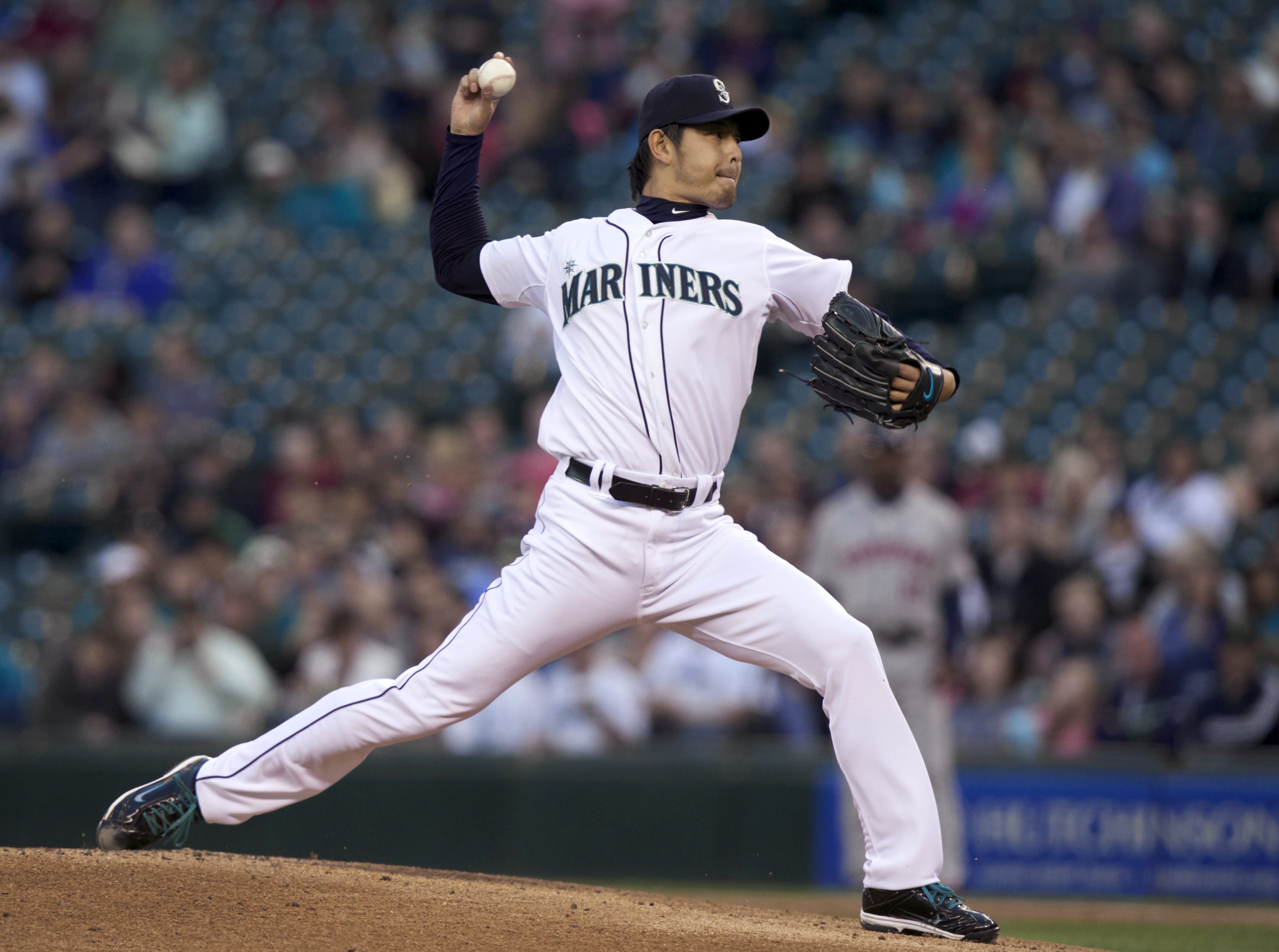 Seattle Mariners starter Hisashi Iwakuma delivers a pitch during the first inning of a baseball game against the Houston Astros, Wednesday, Sept. 10, 2014, in Seattle.