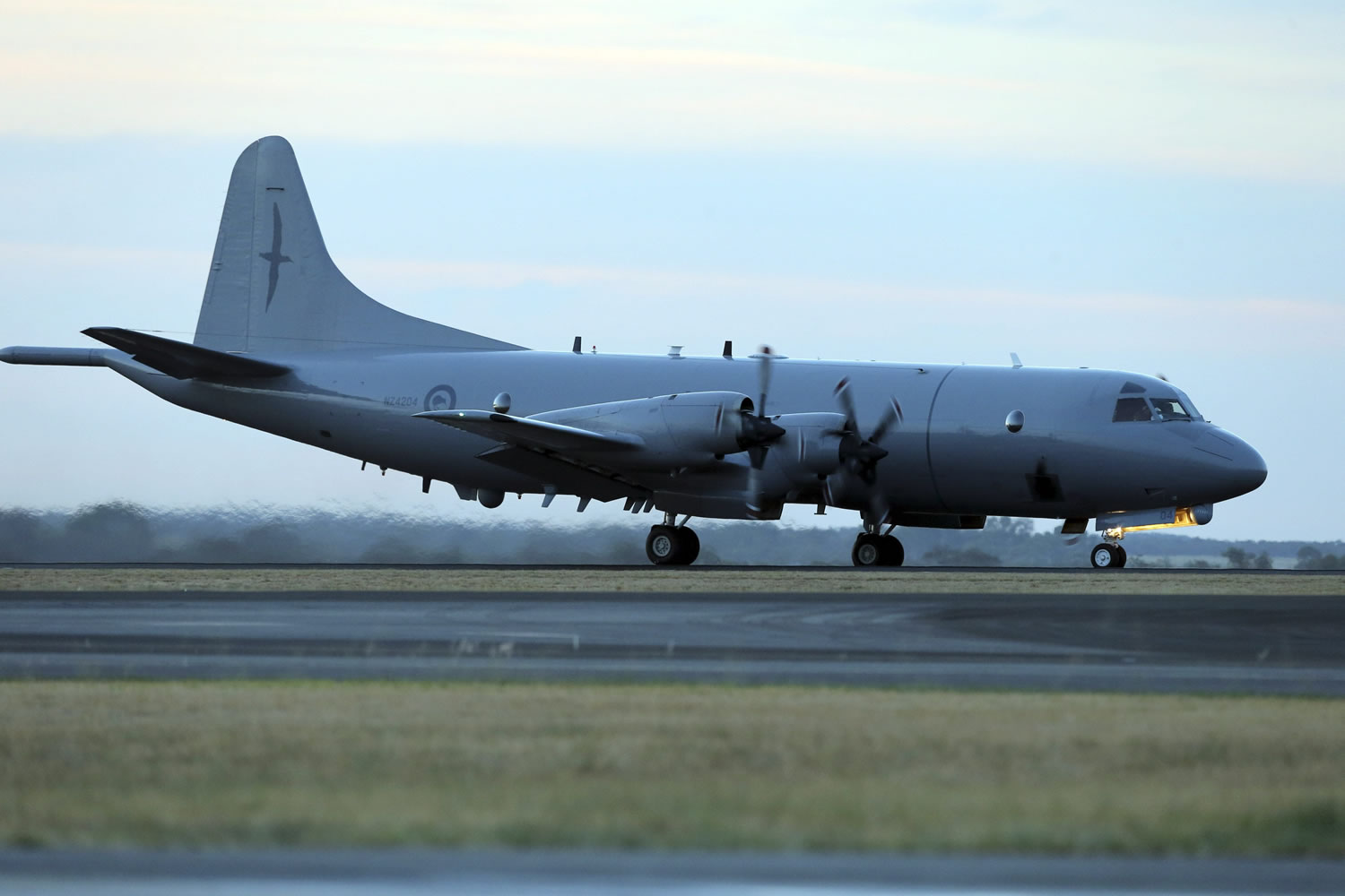A Royal New Zealand Air Force P-3 Orion lands at Royal Australian Air Force Base Peace after completing their day's  search for the missing Malaysia Airlines Flight MH370 in Perth, Australia, on Friday.