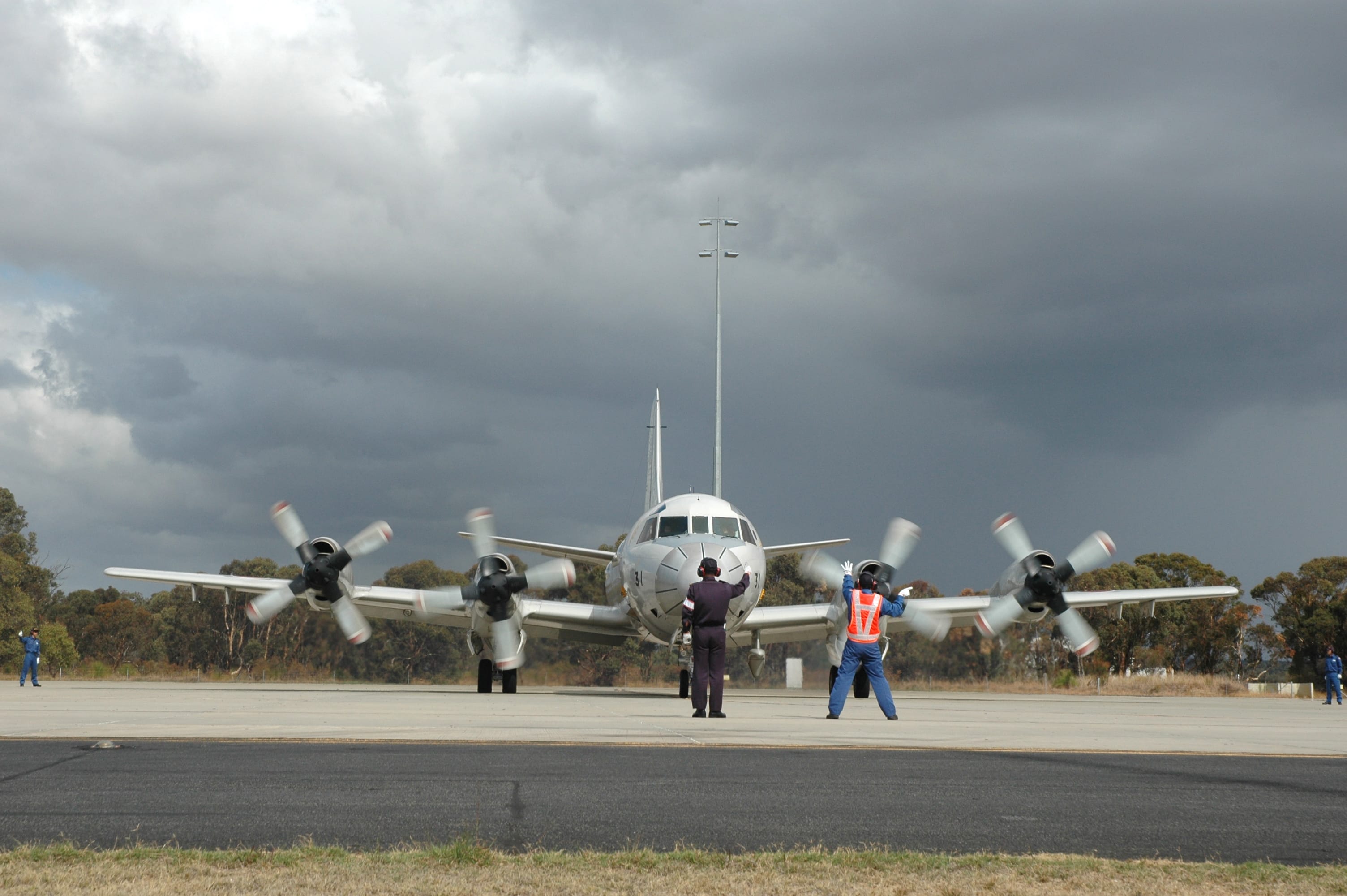 A Japanese P-3C Orion is guided by ground crew as it taxis along the tarmac at RAAF Base Pearce before departing for Japan's final search flight for the missing Malaysia Airlines flight MH370 on Monday.
