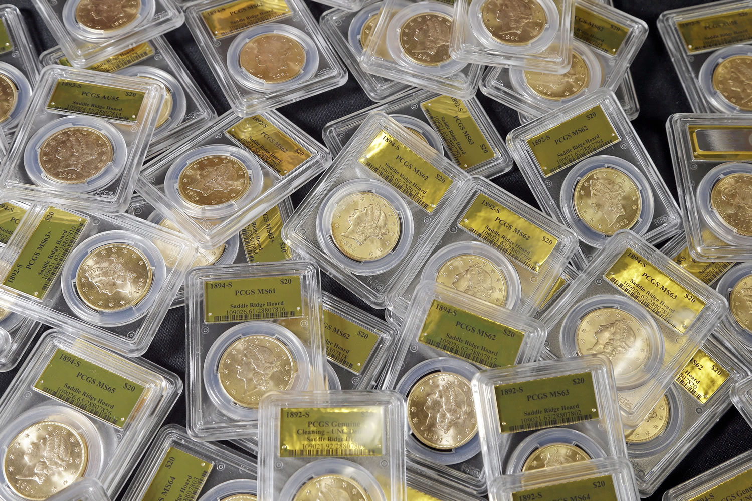 Associated Press files
Some of the 1,427 Gold-Rush-era U.S. gold coins discovered by a couple out walking their dog are shown in February.