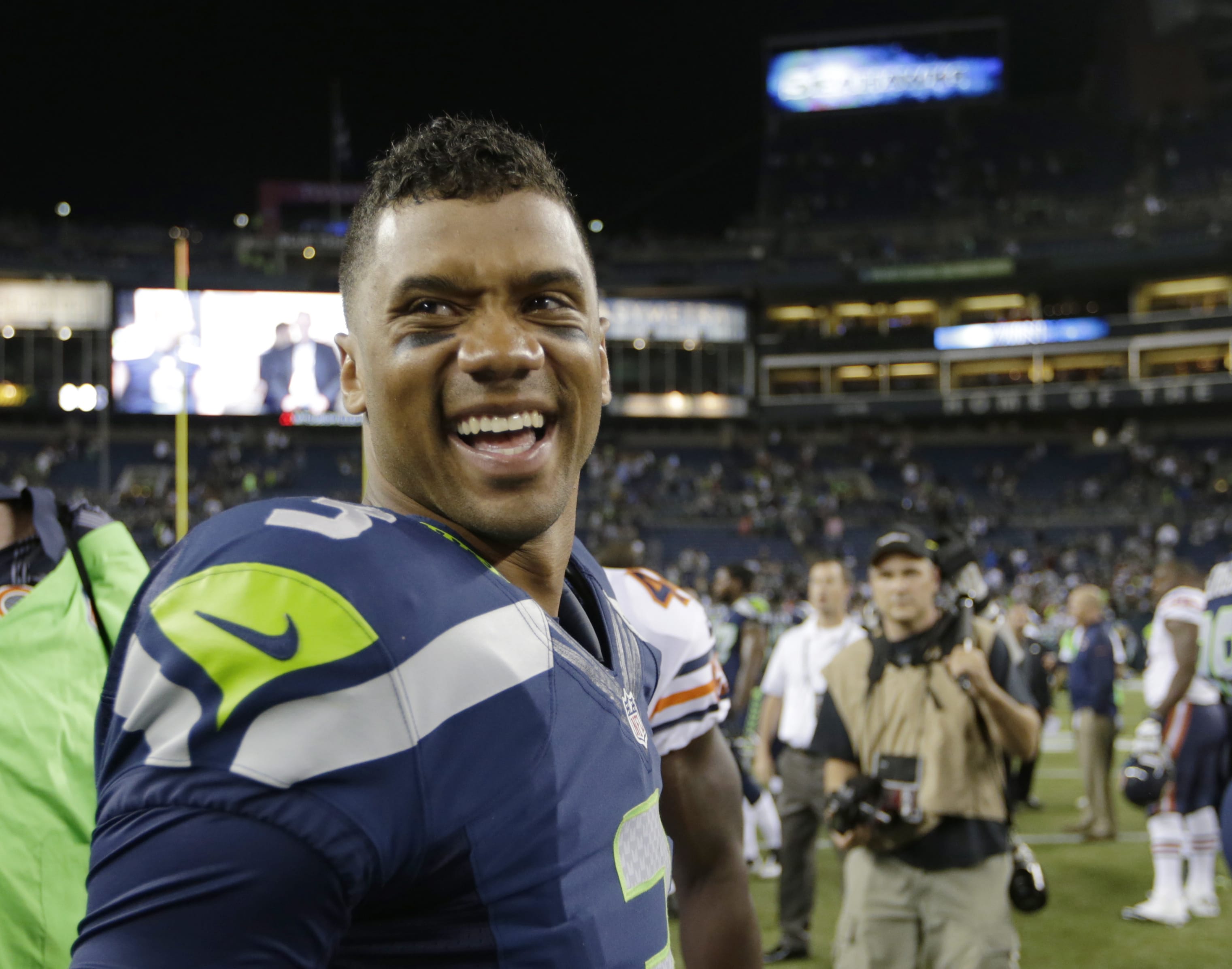 Seattle Seahawks quarterback Russell Wilson (3) smiles after the Seahawks' 34-6 win over the Chicago Bears in a preseason NFL football game Friday in Seattle.