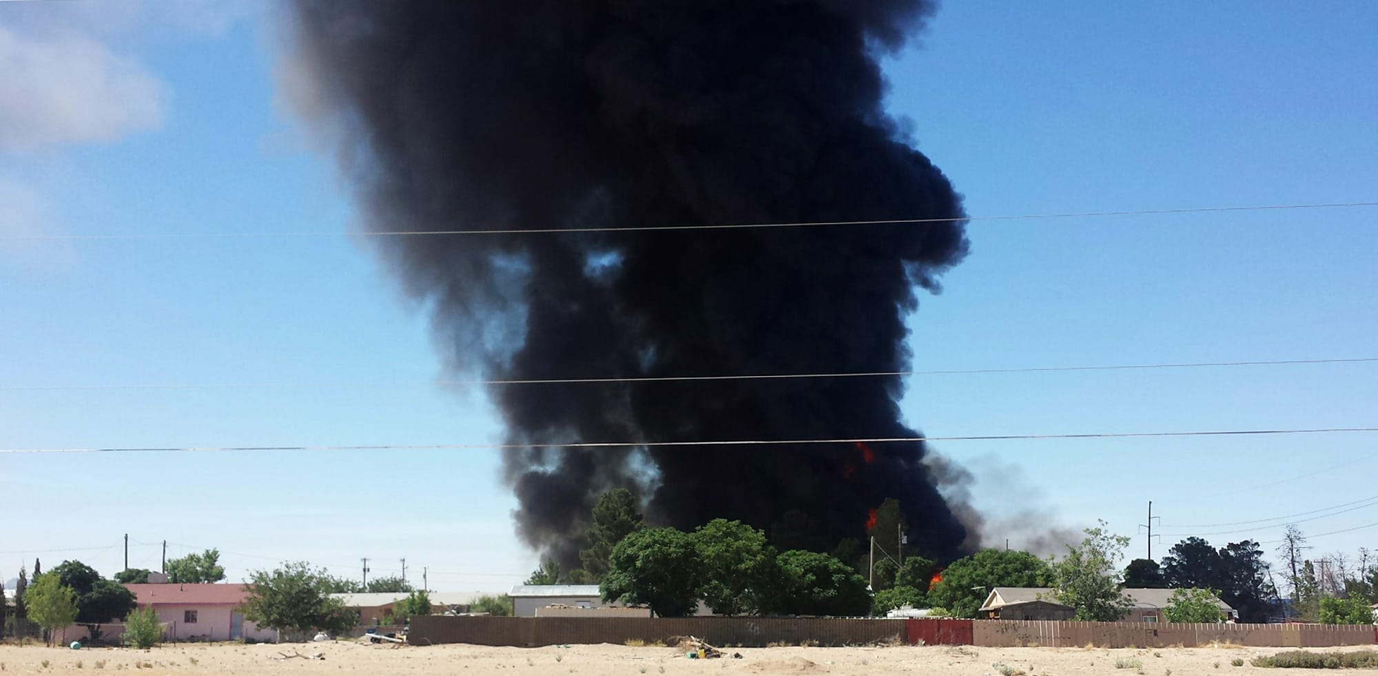 Smoke rises from a fire at a biofuel facility near Anthony, N.M., on Tuesday.