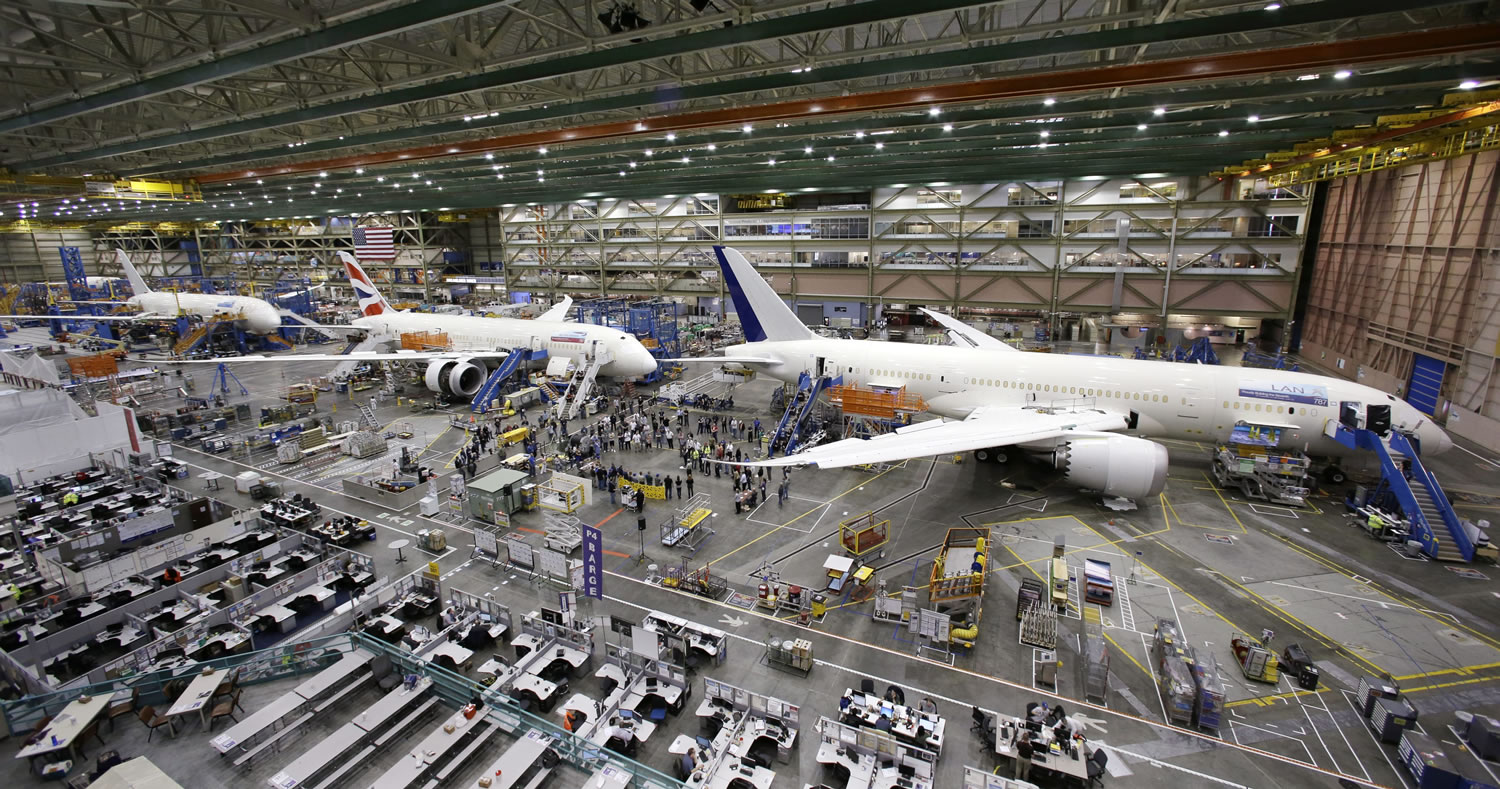 A line of Boeing 787 jets sitting on the floor nearing completion at the company's production plant in Everett.