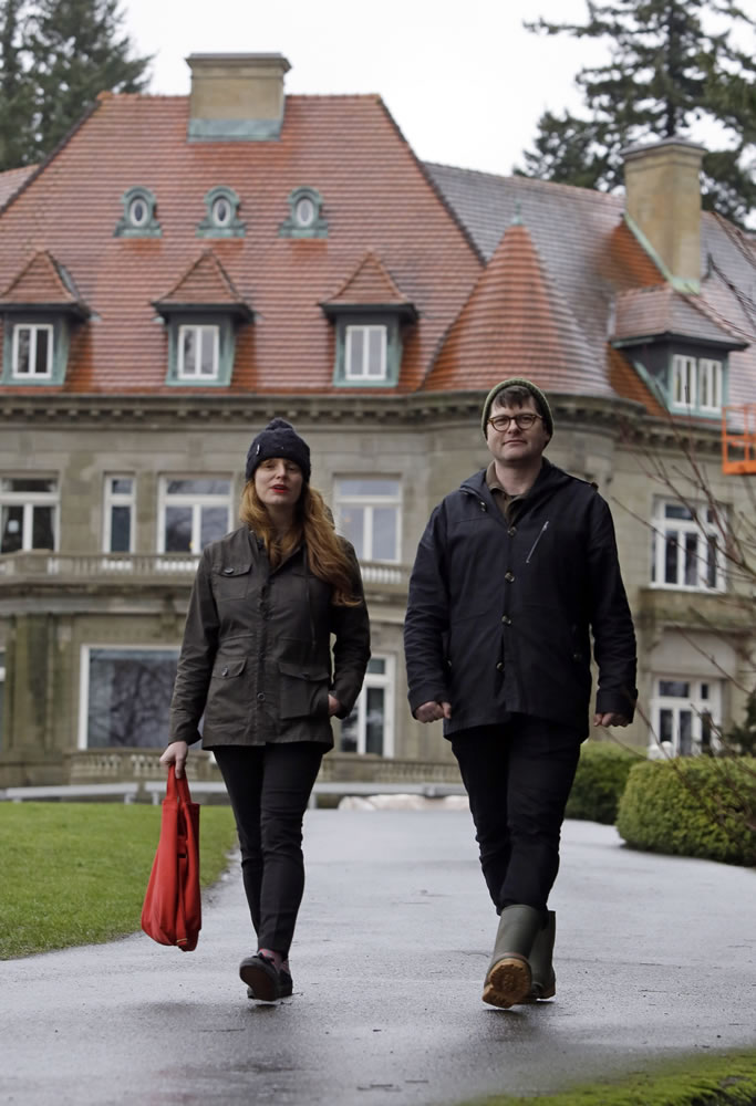 Colin Meloy, right, front man and songwriter for the indie folk band, The Decemberists, and his illustrator wife, Carson Ellis, walk in front of Pittock Mansion in the west hills of Portland.