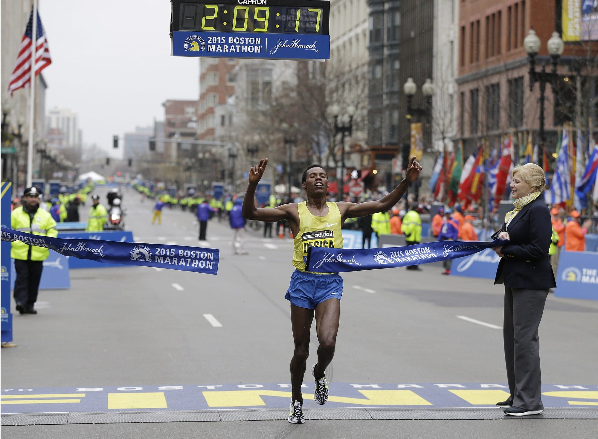 Lelisa Desisa, of Ethiopia, crosses the finish line to win the Boston Marathon, Monday, April 20, 2015, in Boston.