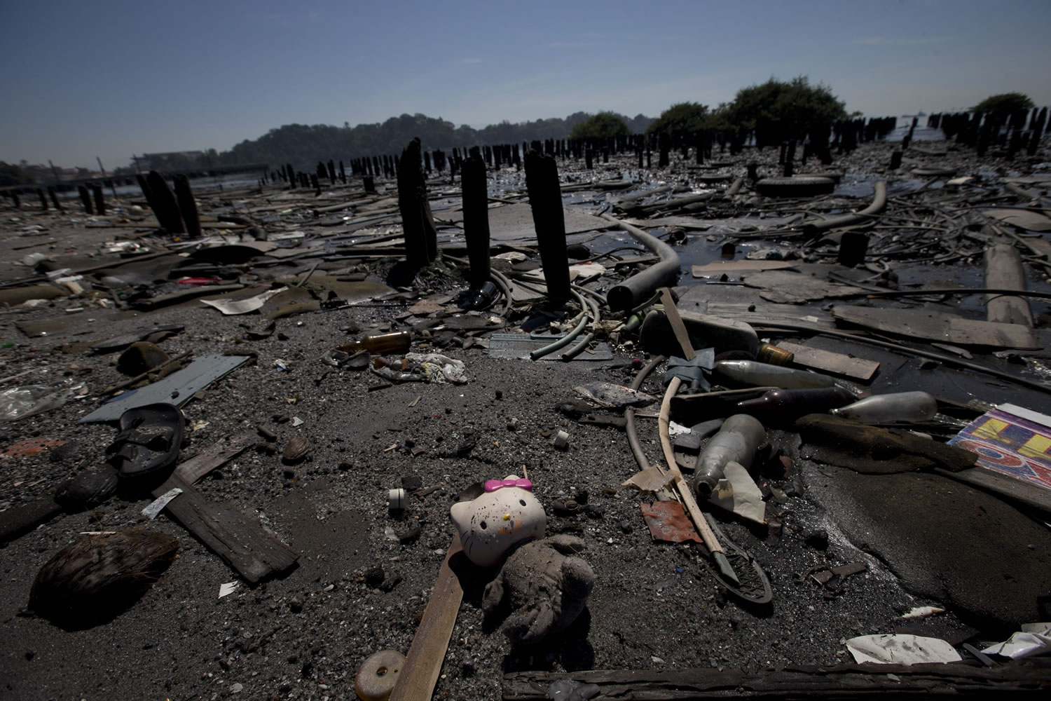 A Hello Kitty doll lays amid the garbage scattered in Guanabara Bay in Rio de Janeiro, Brazil. Rio Governor Luiz Fernando Pezao recently pushed back the 2016 deadline for cleaning the bay where the Olympic sailing competitions are to be staged, to 2035.
