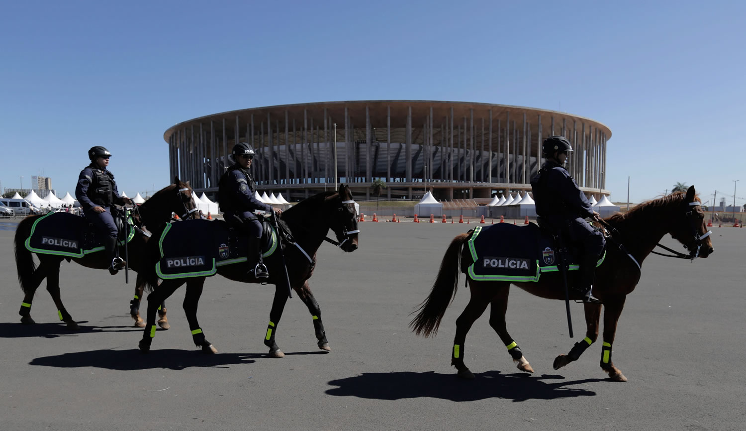 Military police patrol on horseback outside the National Stadium in Brasilia, Brazil, on Wednesday.