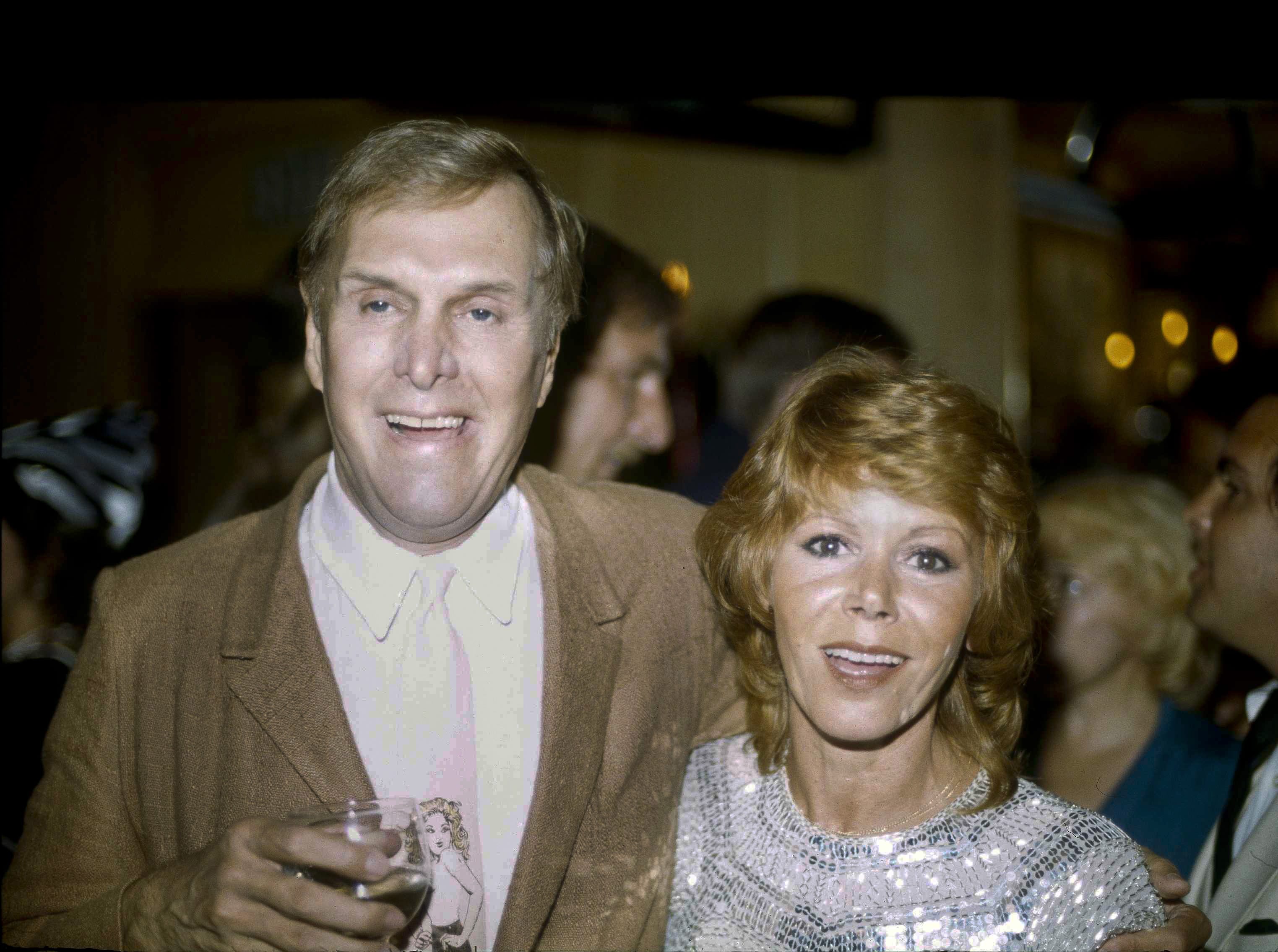FILE - In this Tuesday, Sept. 13, 1983 file photo, actors Judy Carne and Alan Sues, left, of &quot;Rowan And Martin's Laugh-In&quot; are shown during a &quot;Laugh-In&quot; reunion party, in Los Angeles. &igrave;Laugh-In&icirc; star Judy Carne has died in a British hospital. She was 76. She was famous for popularizing the &igrave;Sock it to Me&icirc; phrase on the hit TV show that started in the late 1960s. Her death was confirmed Tuesday, Sept. 8, 2015 in an e-mail by Eva Duffy, spokeswoman for Northampton General Hospital. Duffy said Carne died in the hospital on September 3. Newspaper reports said she had suffered from pneumonia.