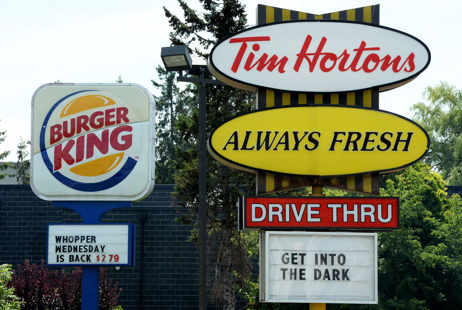A Burger King sign and a Tim Hortons sign are displayed on St.