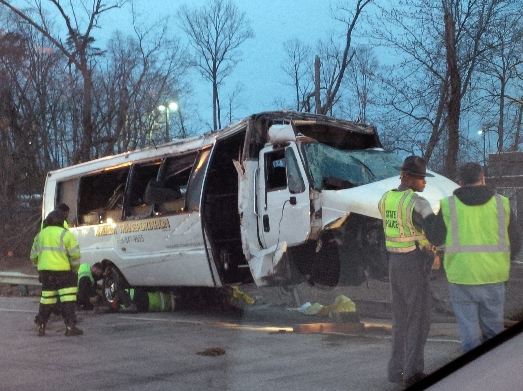 Virginia State Police
Police investigate the scene of a bus accident on Interstate 95 in Fairfax County, Va. The shuttle bus struck a guardrail and overturned before dawn Sunday.