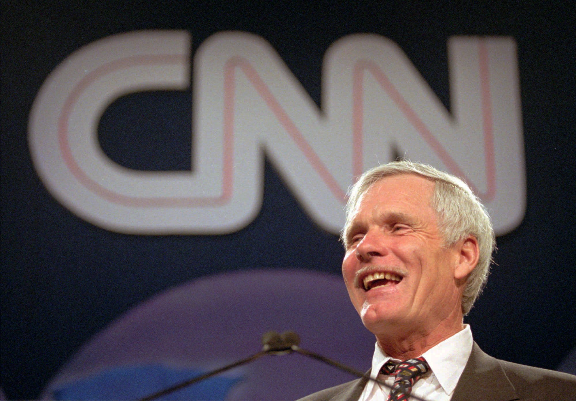 Ted Turner laughs as he speaks during the CNN World Report Contributors banquet May 4, 1995, in Atlanta.