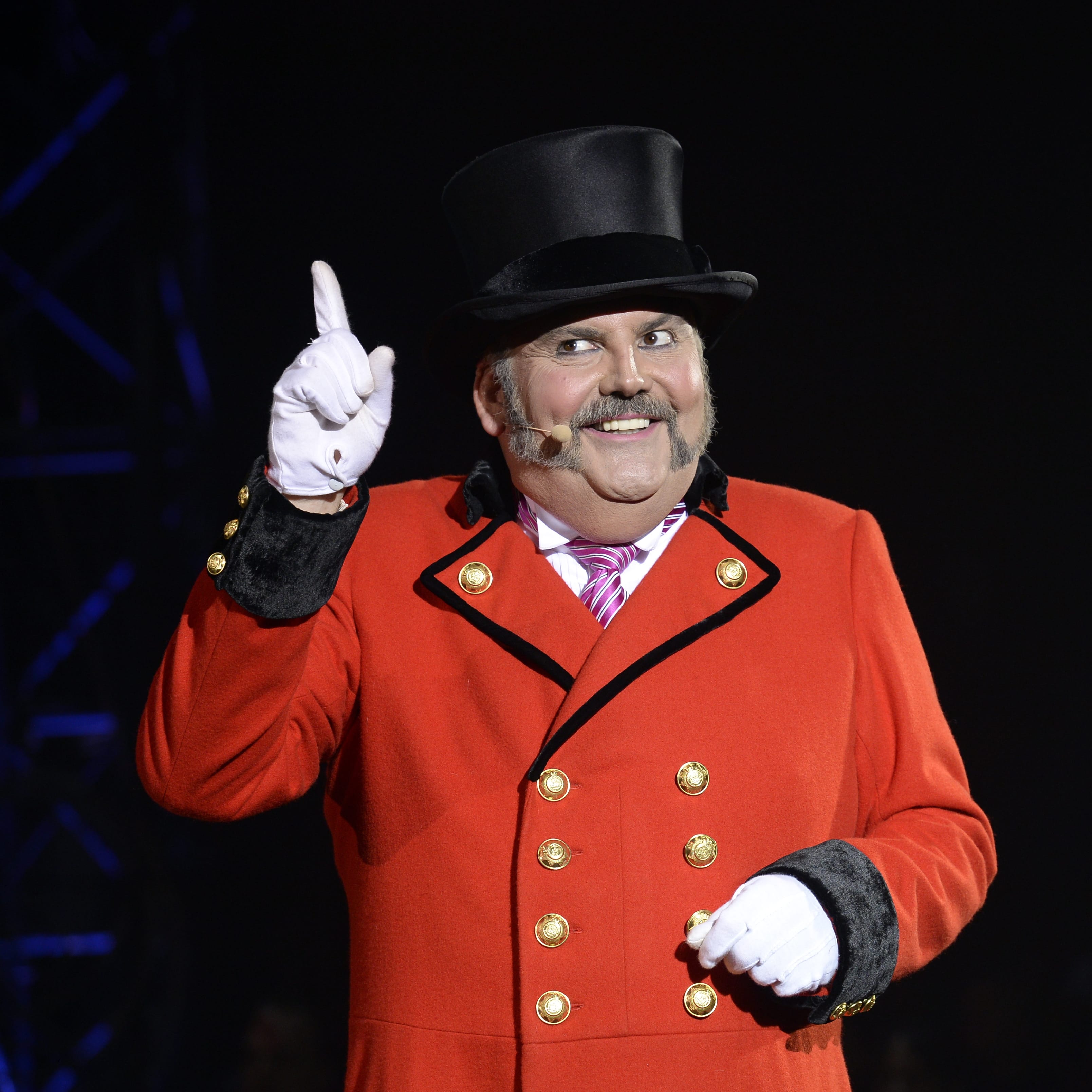 John Kennedy Kane is the ringmaster of the Big Apple Circus. Big Apple Circus' new show, &quot;Metamorphosis,&quot; will be broadcast to cinema screens Nov.
