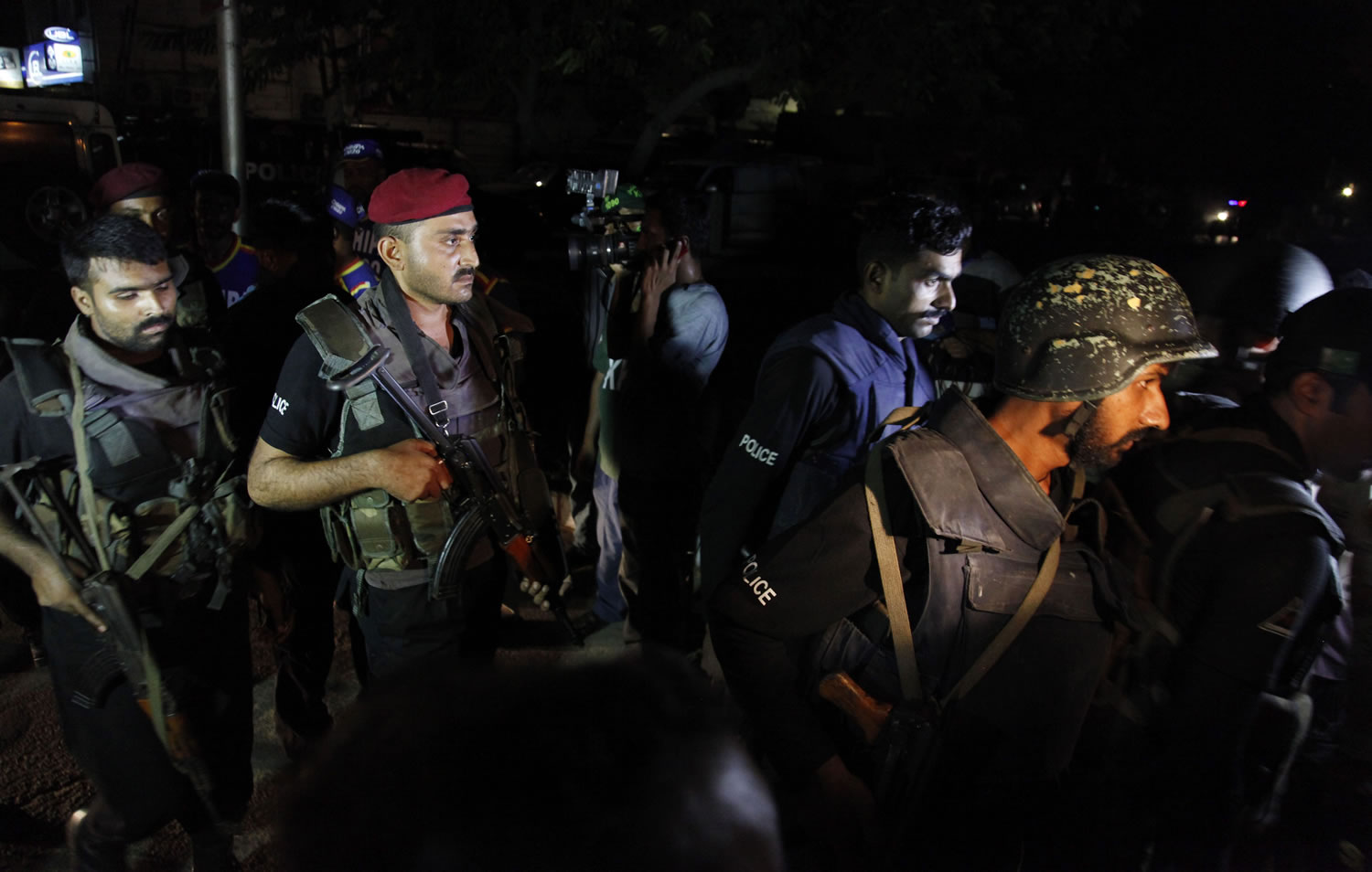 Pakistani commandos get ready to enter Karachi airport terminal following attacks by unknown gunmen on Sunday night.