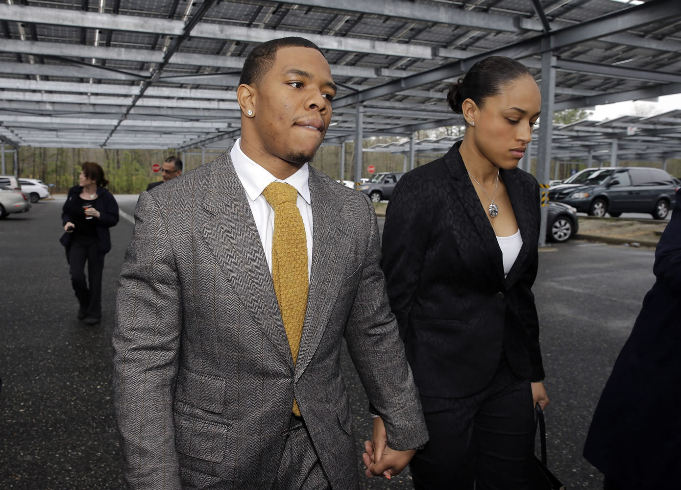 Baltimore Ravens football player Ray Rice holds hands with his wife, Janay Palmer, as they arrive May 1 at Atlantic County Criminal Courthouse in Mays Landing, N.J.