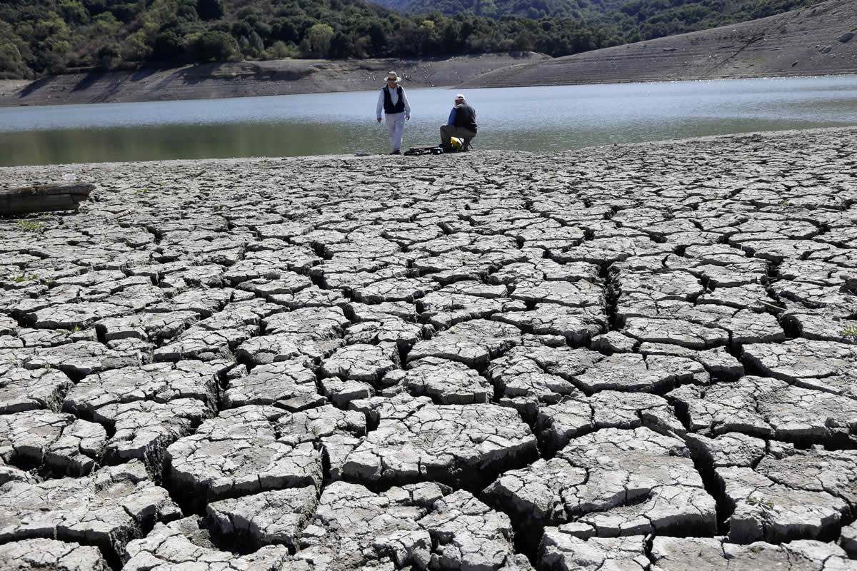 The dry and cracked  bed of the Stevens Creek Reservoir is shown  March 13 in Cupertino, Calif.