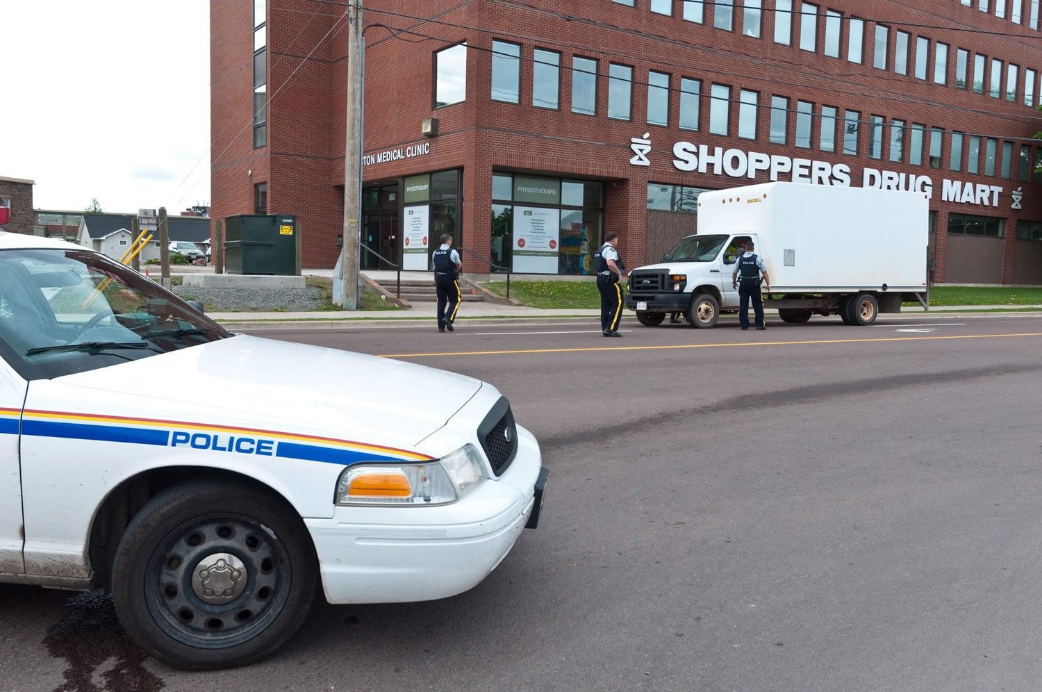 Royal Canadian Mounted Police check a van at a roadblock in Moncton, New Brunswick, on Thursday.