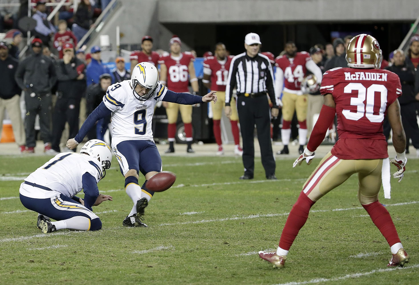 San Diego Chargers's Nick Novak (9) kicks a 40-yard field goal from the hold of Mat McBriar in overtime against the San Francisco 49ers in Santa Clara, Calif., Saturday, Dec. 20, 2014. The Chargers won 38-35.