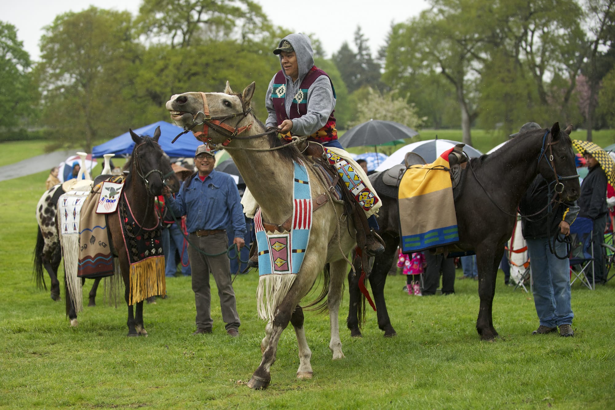Four horses are lead around the crowd during the Riderless Horse Ceremony at the 17th Annual Nez Perce Chief Redheart Memorial Ceremony at the Fort Vancouver National Historic Site on Saturday.