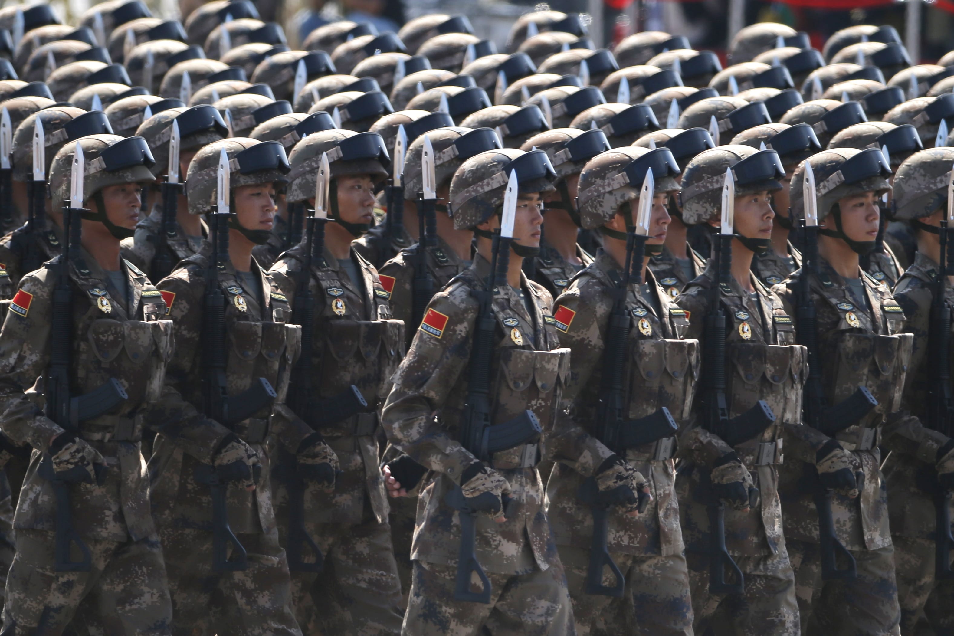 Chinese soldiers take part in a parade commemorating the 70th anniversary of Japan's surrender during World War II in front of Tiananmen Gate in Beijing, Thursday, Sept. 3, 2015. The spectacle involved more than 12,000 troops, 500 pieces of military hardware and 200 aircraft of various types, representing what military officials say is the Chinese military's most cutting-edge technology.