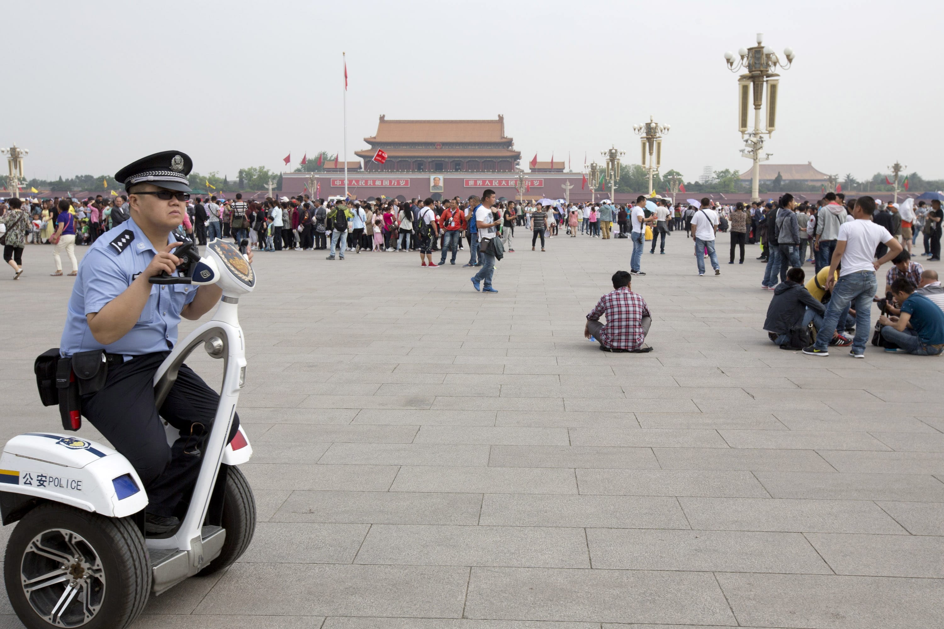 A policeman patrols Tiananmen Square in Beijing on an electric personal transporter on May 17.